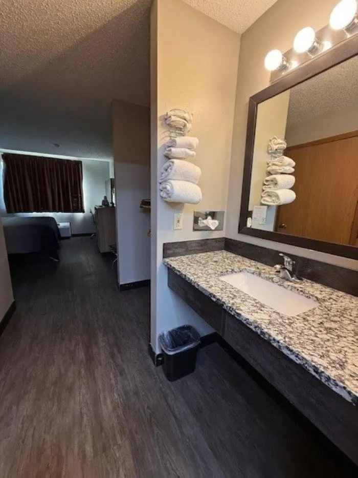 Bed in Super 8 by Wyndham Smithville Kansas City