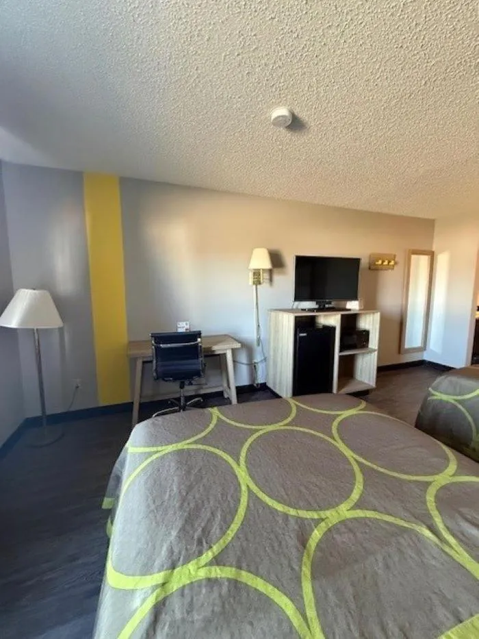 Bed in Super 8 by Wyndham Smithville Kansas City