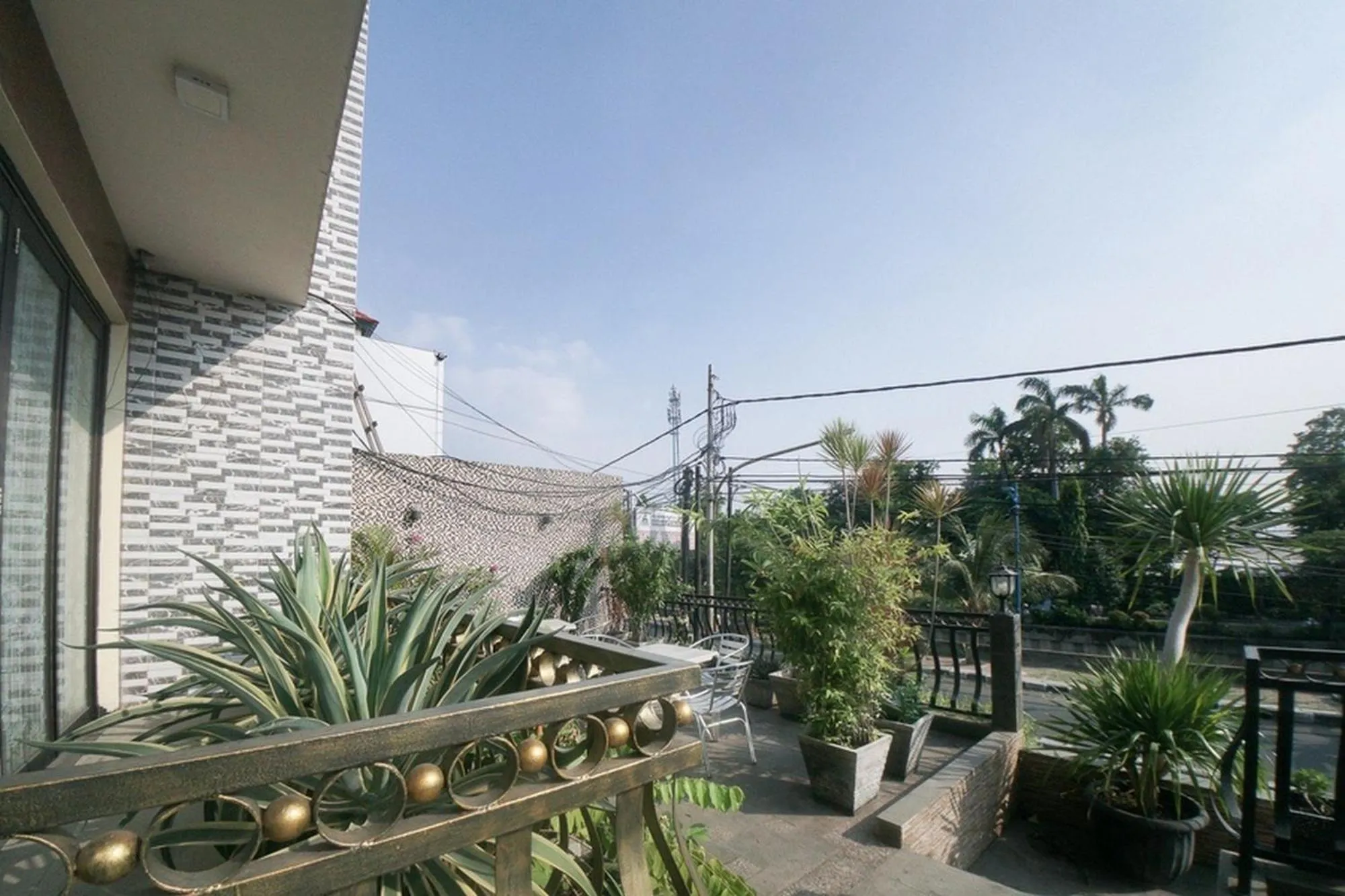 Balcony/Terrace in RedDoorz Plus near Green Pramuka Square Mall