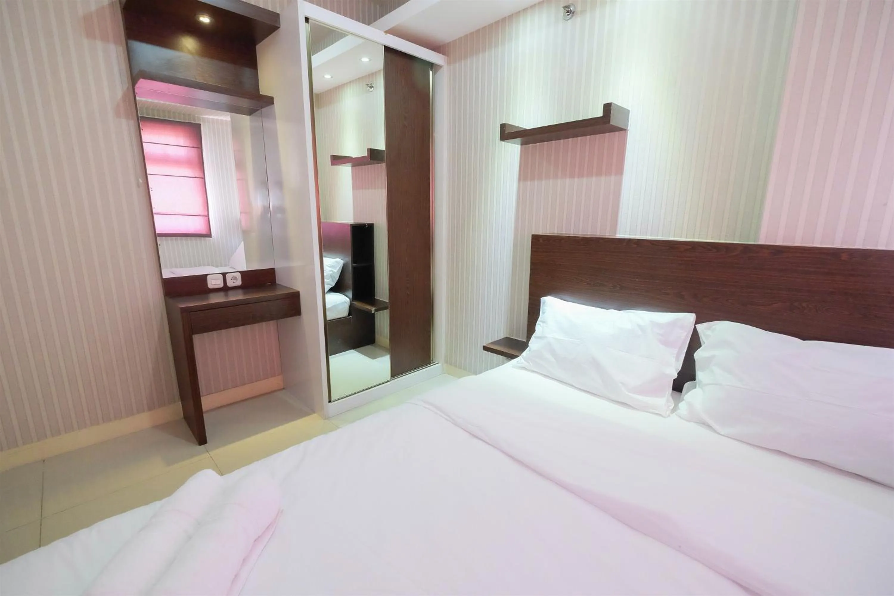 Bedroom, Bed in Homey and Relaxing 2BR Green Pramuka City Apartment By Travelio