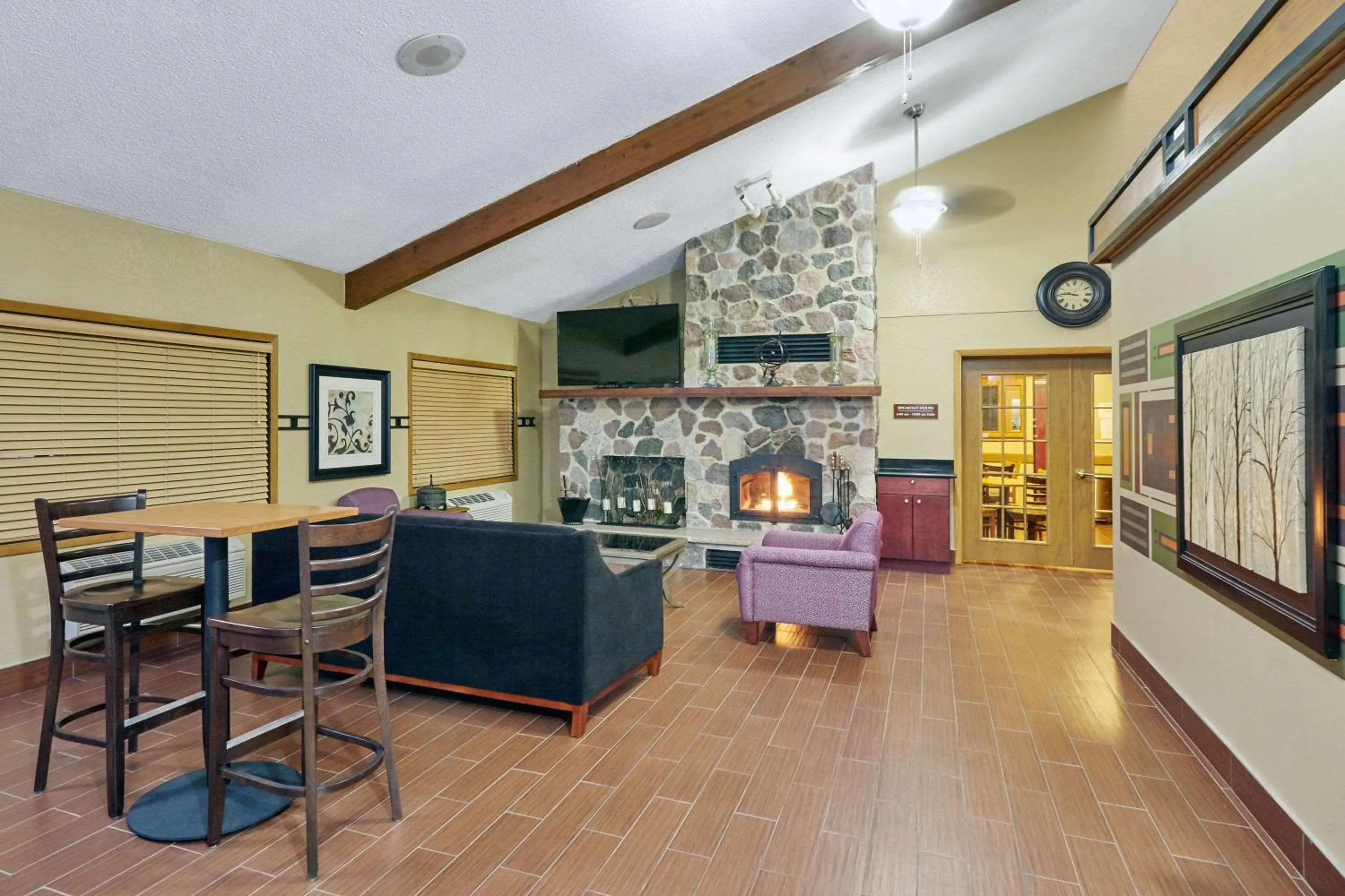 Seating area in AmericInn by Wyndham Burlington