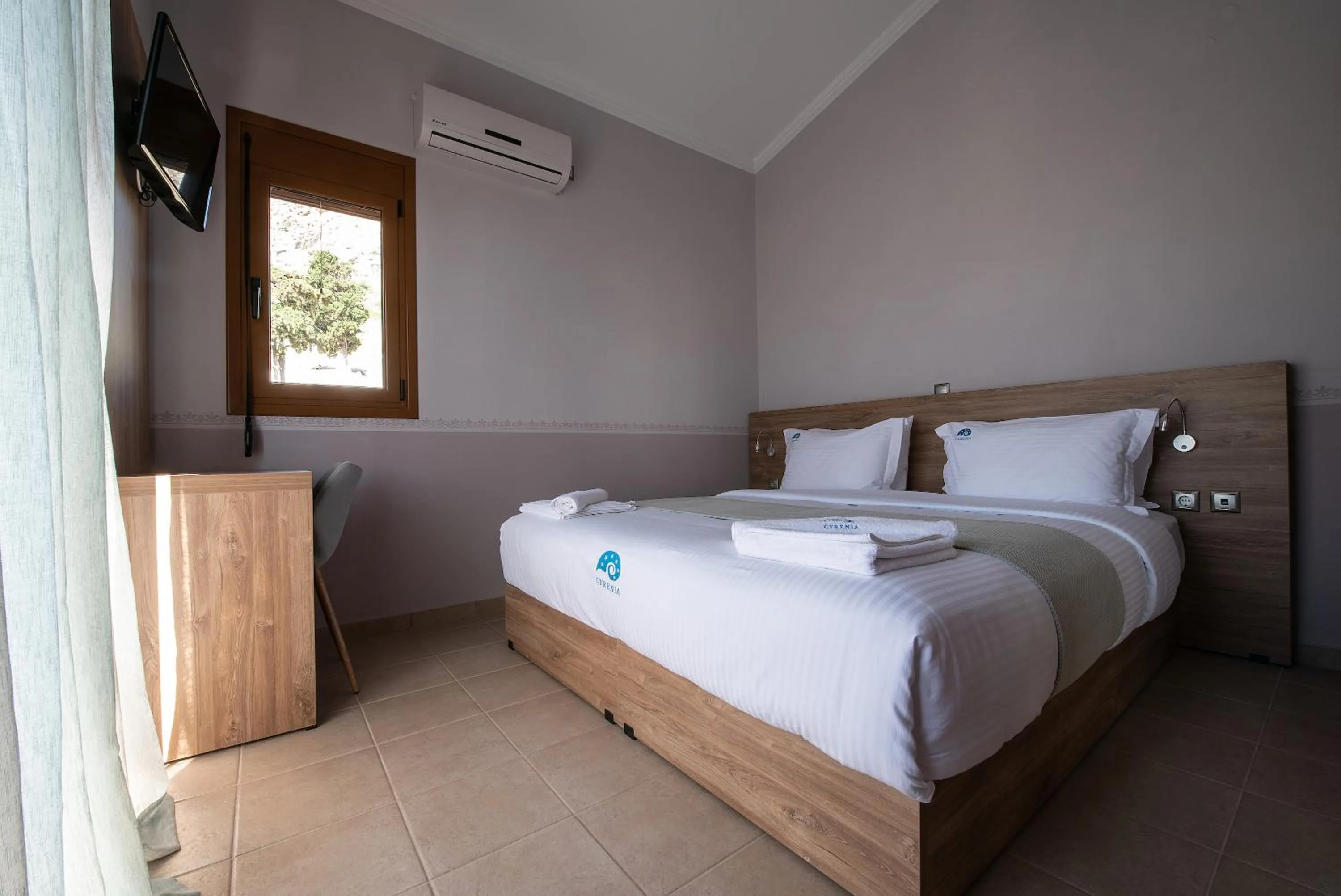 Bed in Cyrenia Guesthouse