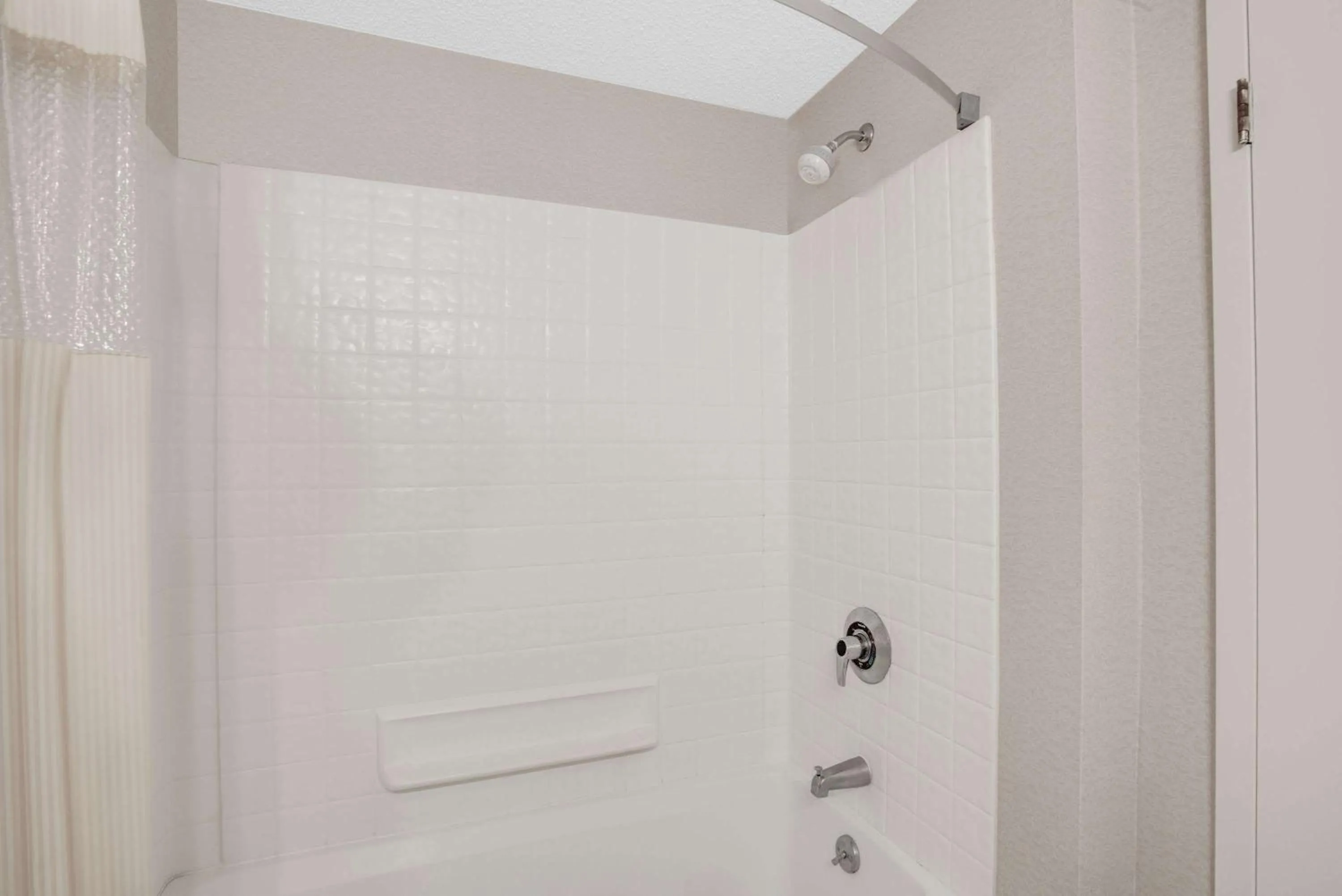 Bathroom in Days Inn by Wyndham Auburn/Finger Lakes Region