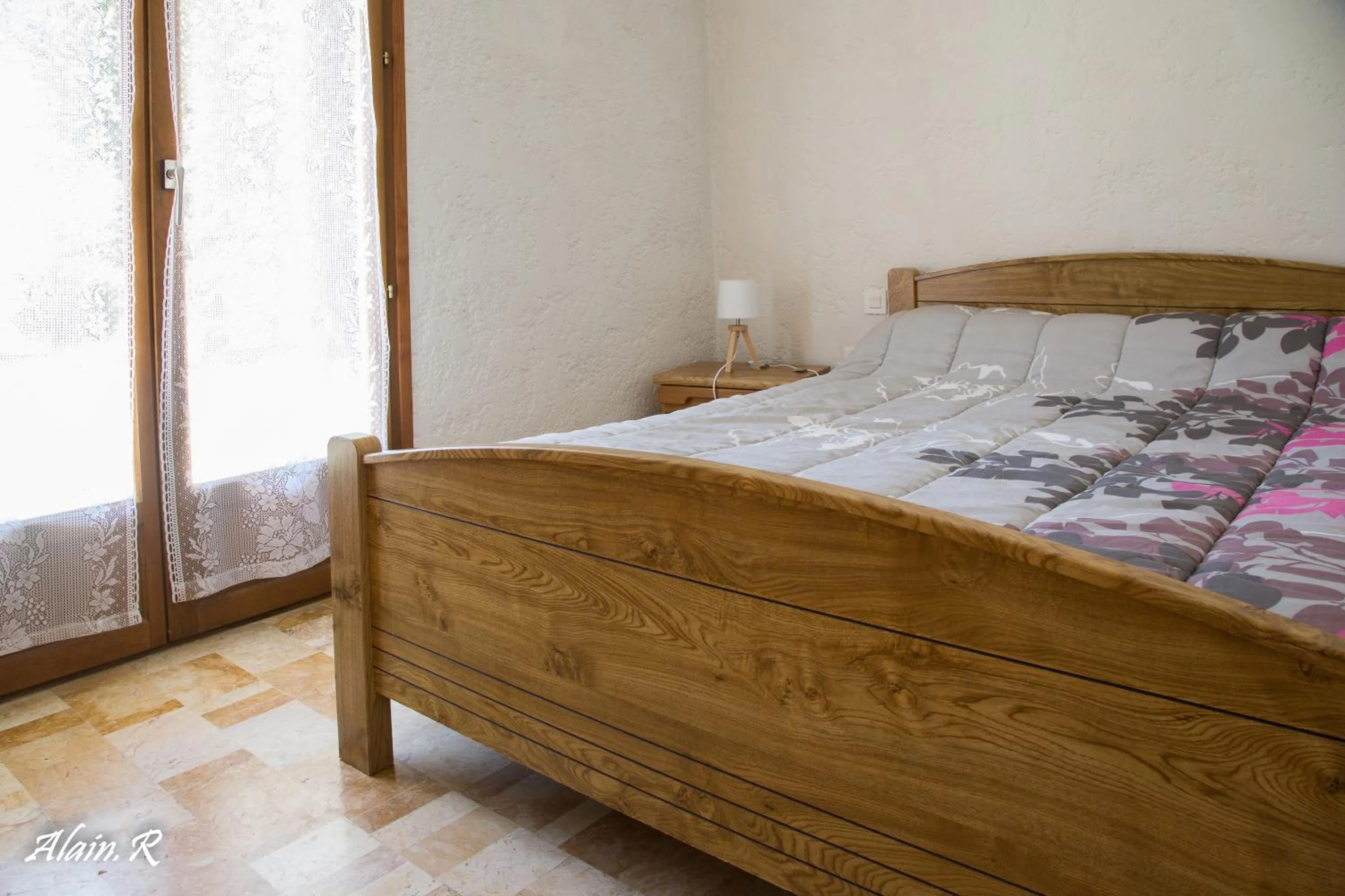 Bed in PARADISE CHALLETS AND CAMPING