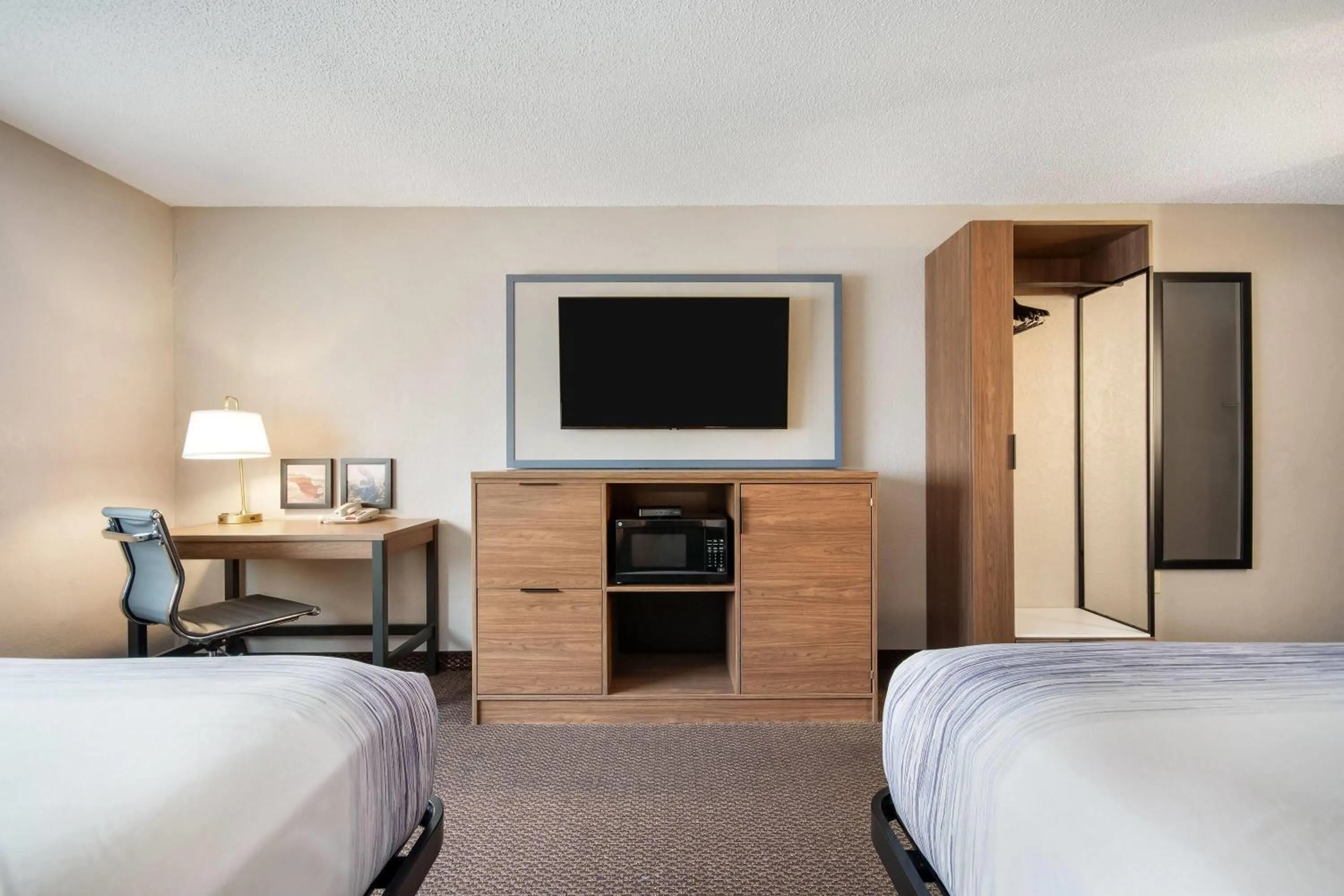 Bed in AmericInn by Wyndham St. Peter