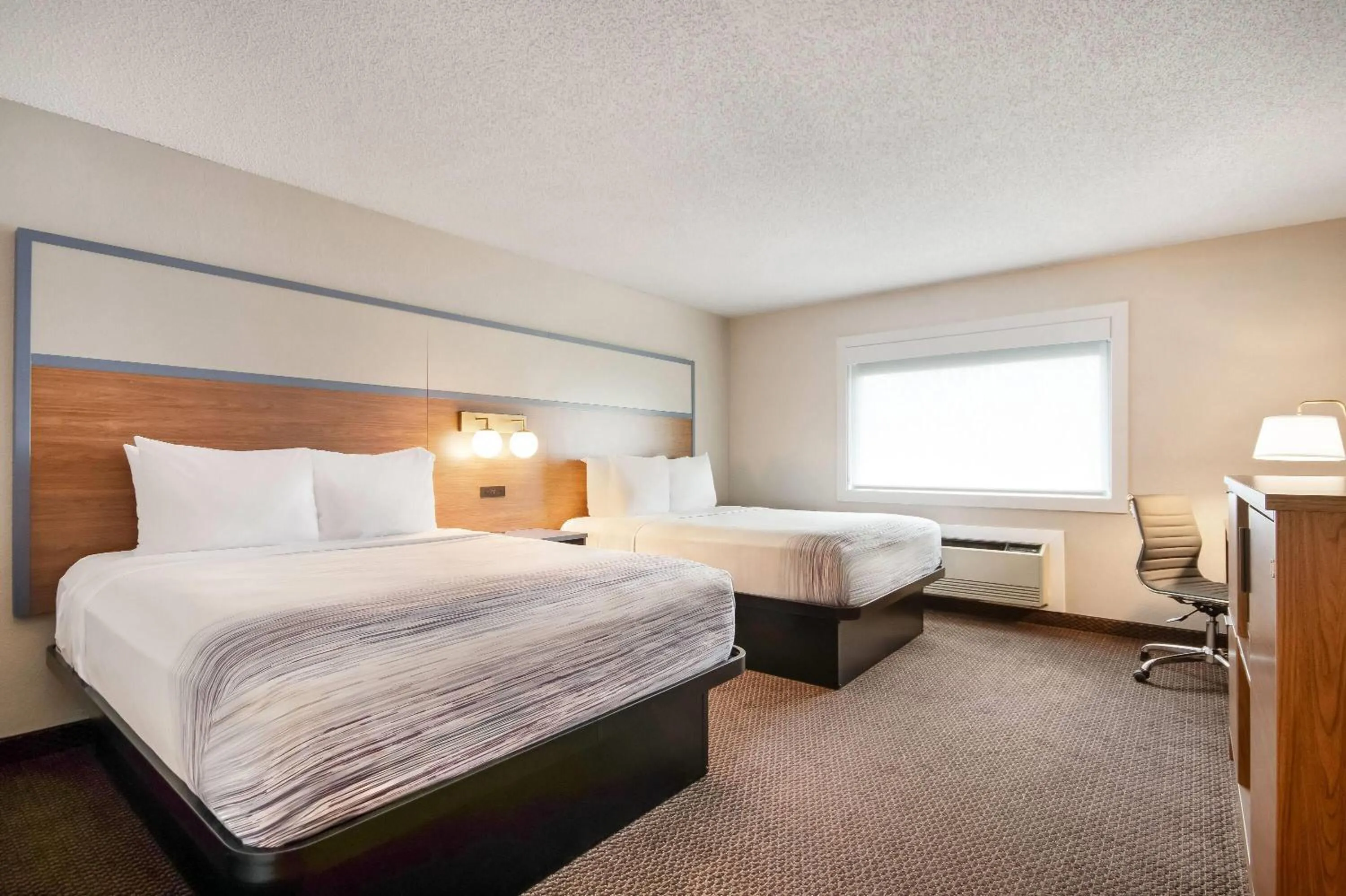 Bed in AmericInn by Wyndham St. Peter