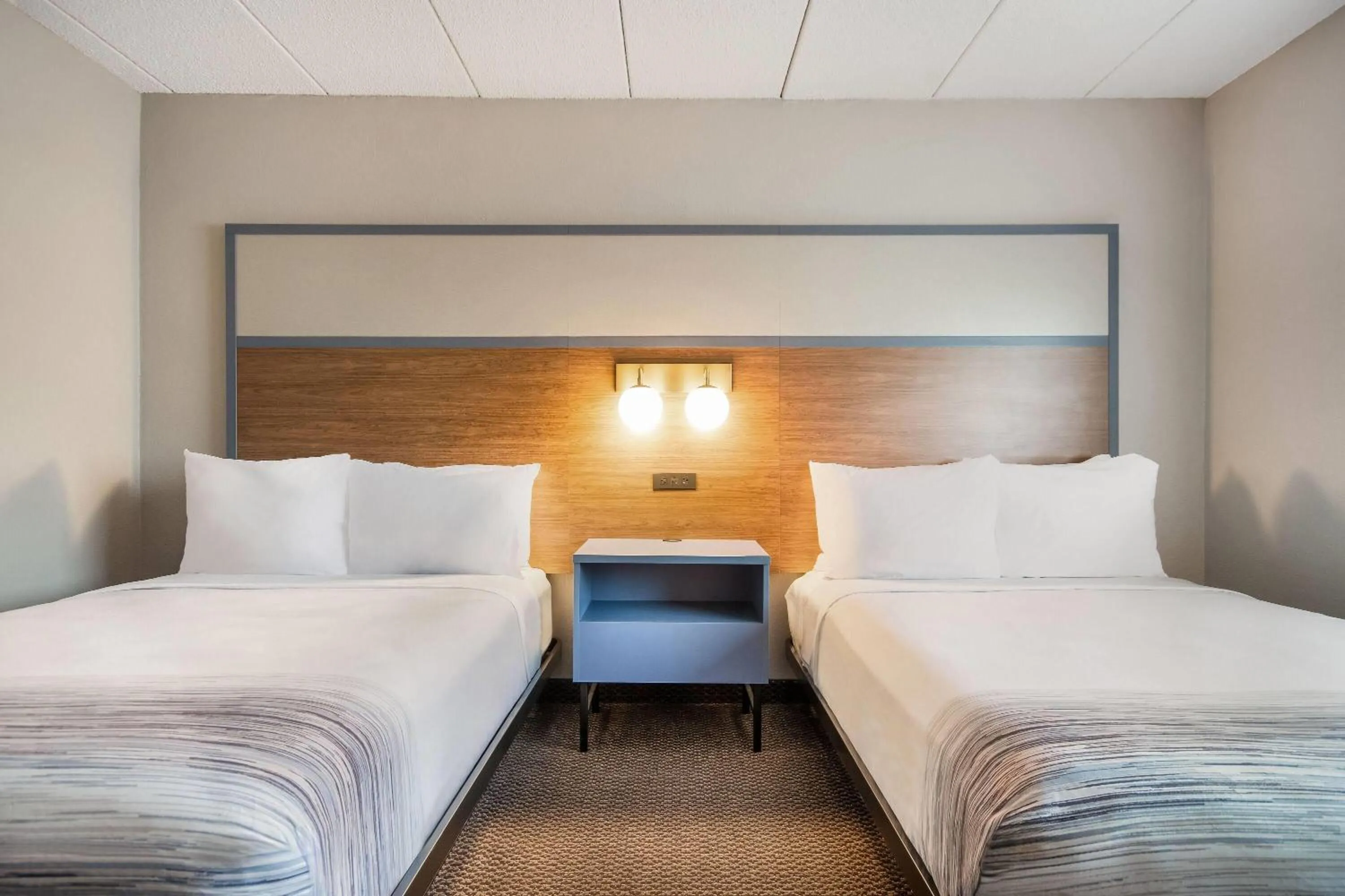 Bed in AmericInn by Wyndham St. Peter