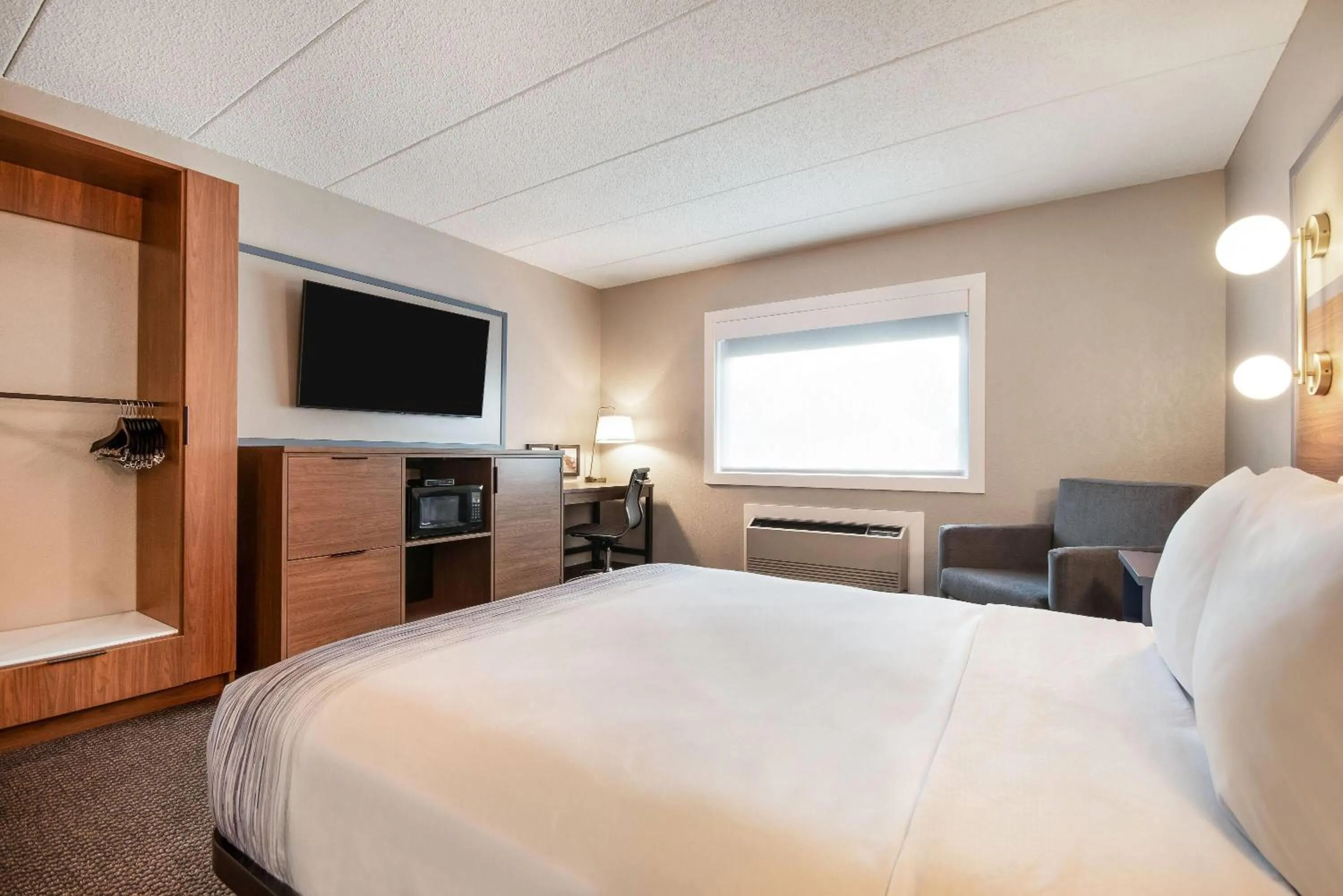 Bed in AmericInn by Wyndham St. Peter