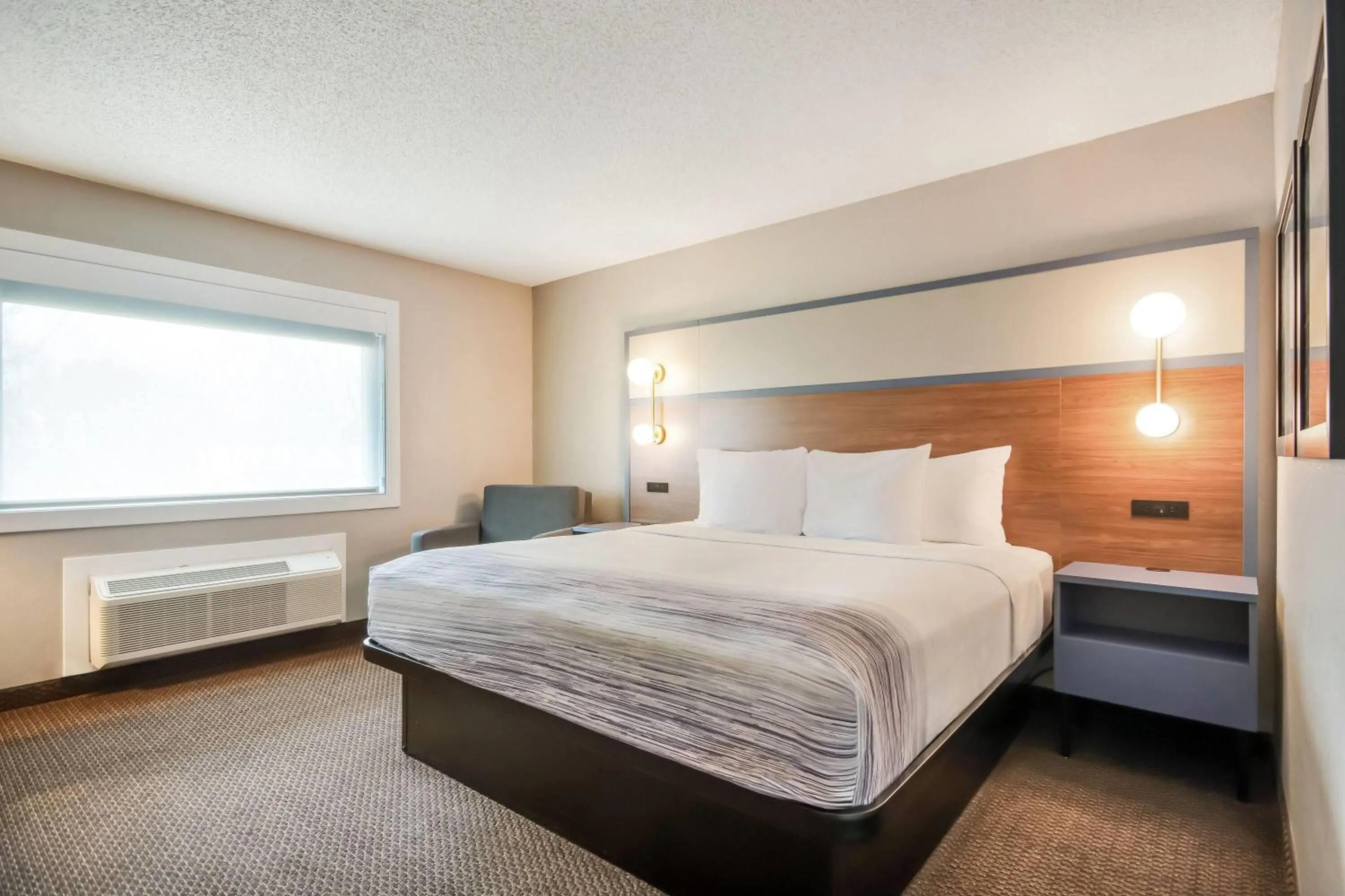 Bed in AmericInn by Wyndham St. Peter