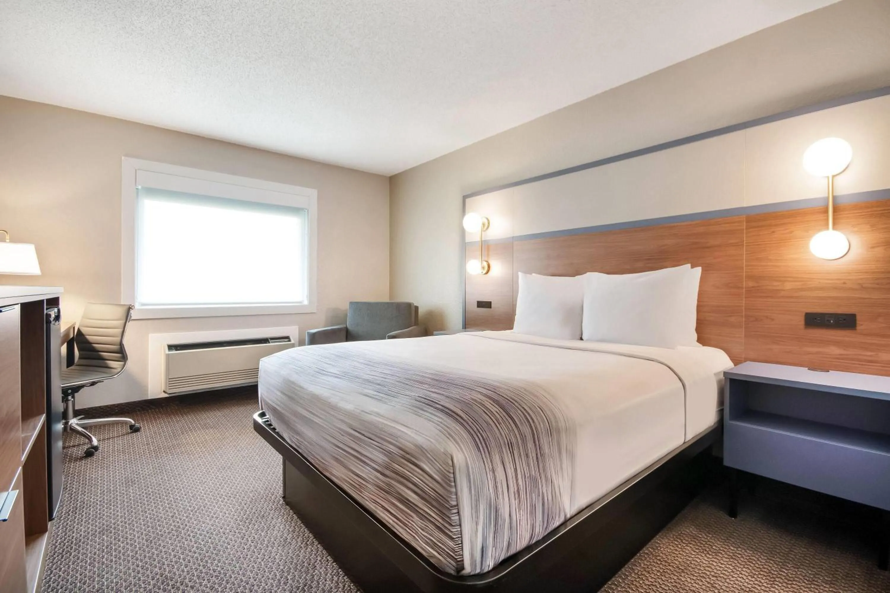 Bed in AmericInn by Wyndham St. Peter