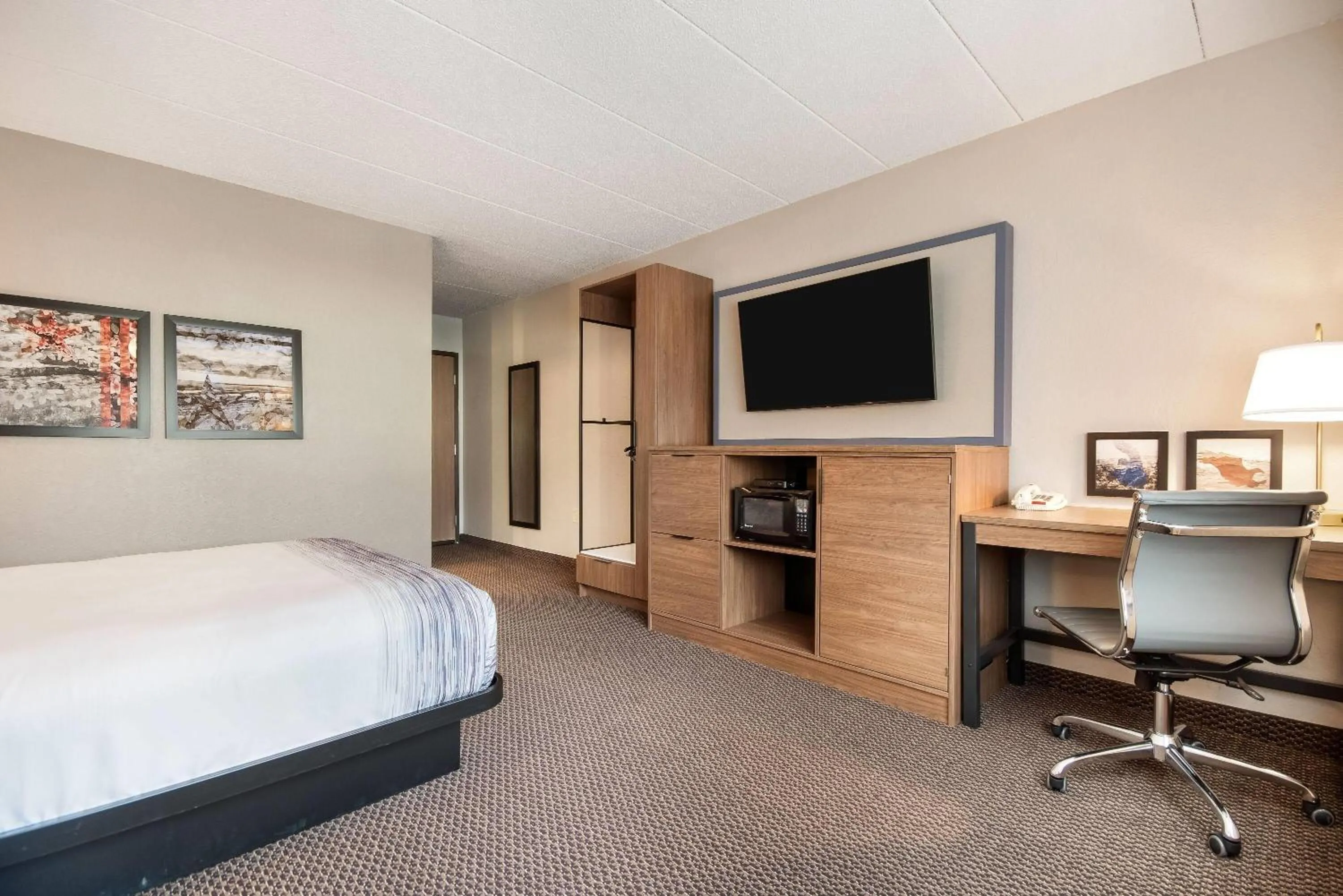 Bed in AmericInn by Wyndham St. Peter