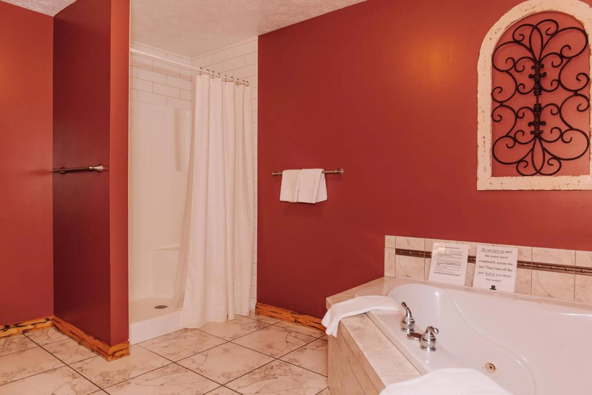 Bed in Sojourner's Lodge & Log Cabin Suites