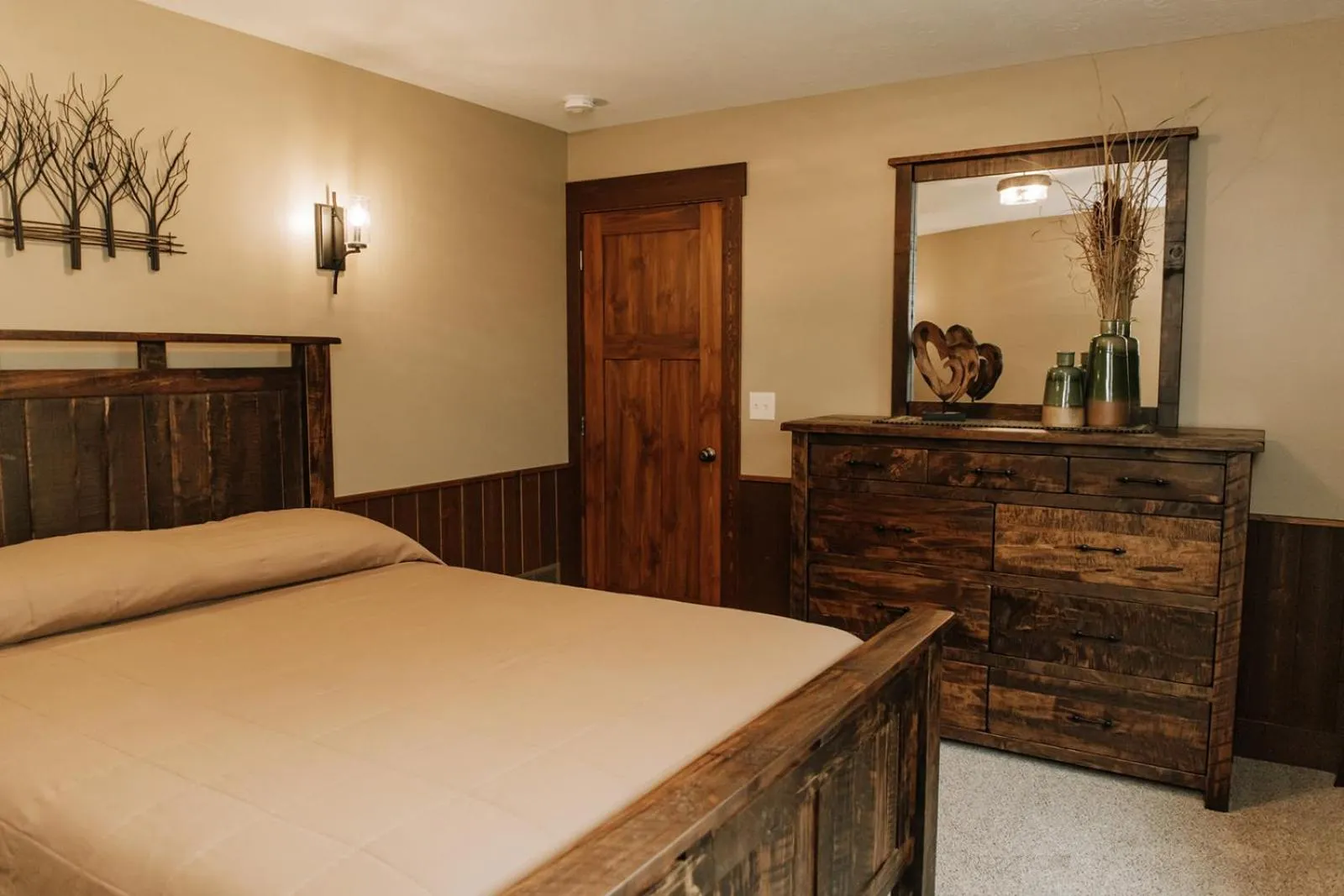 Bed in Sojourner's Lodge & Log Cabin Suites