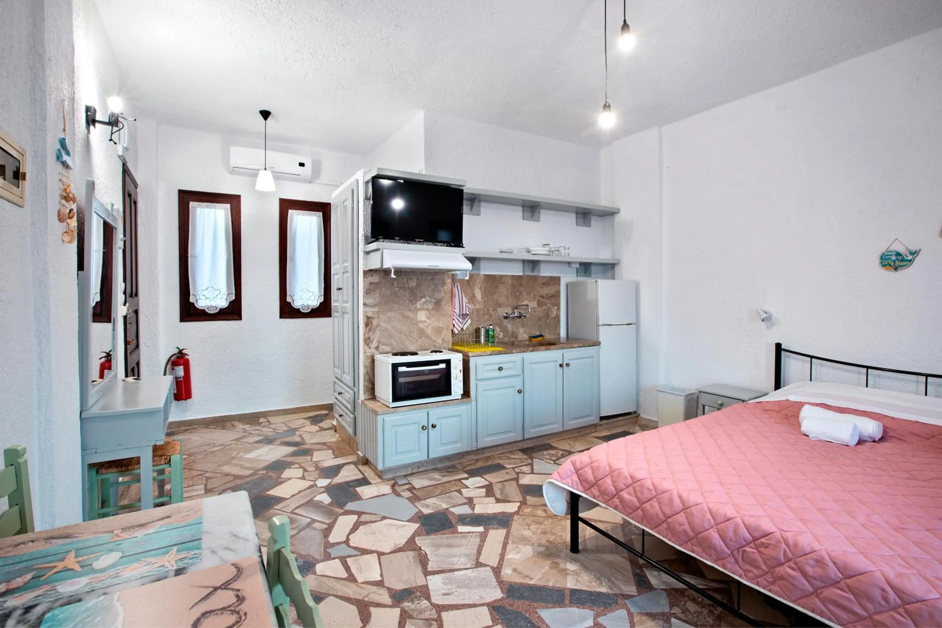 Bed in New Aurora Apts Studios