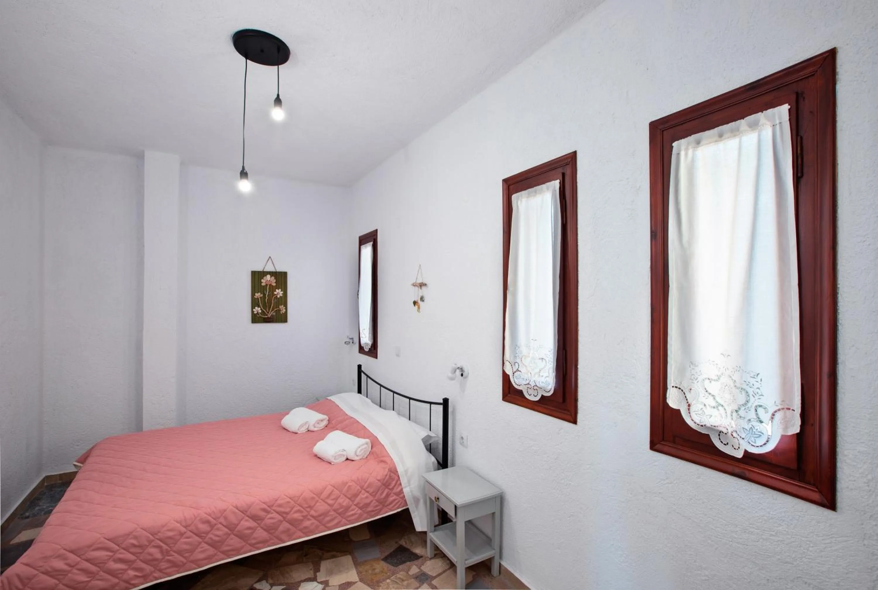 Bed in New Aurora Apts Studios