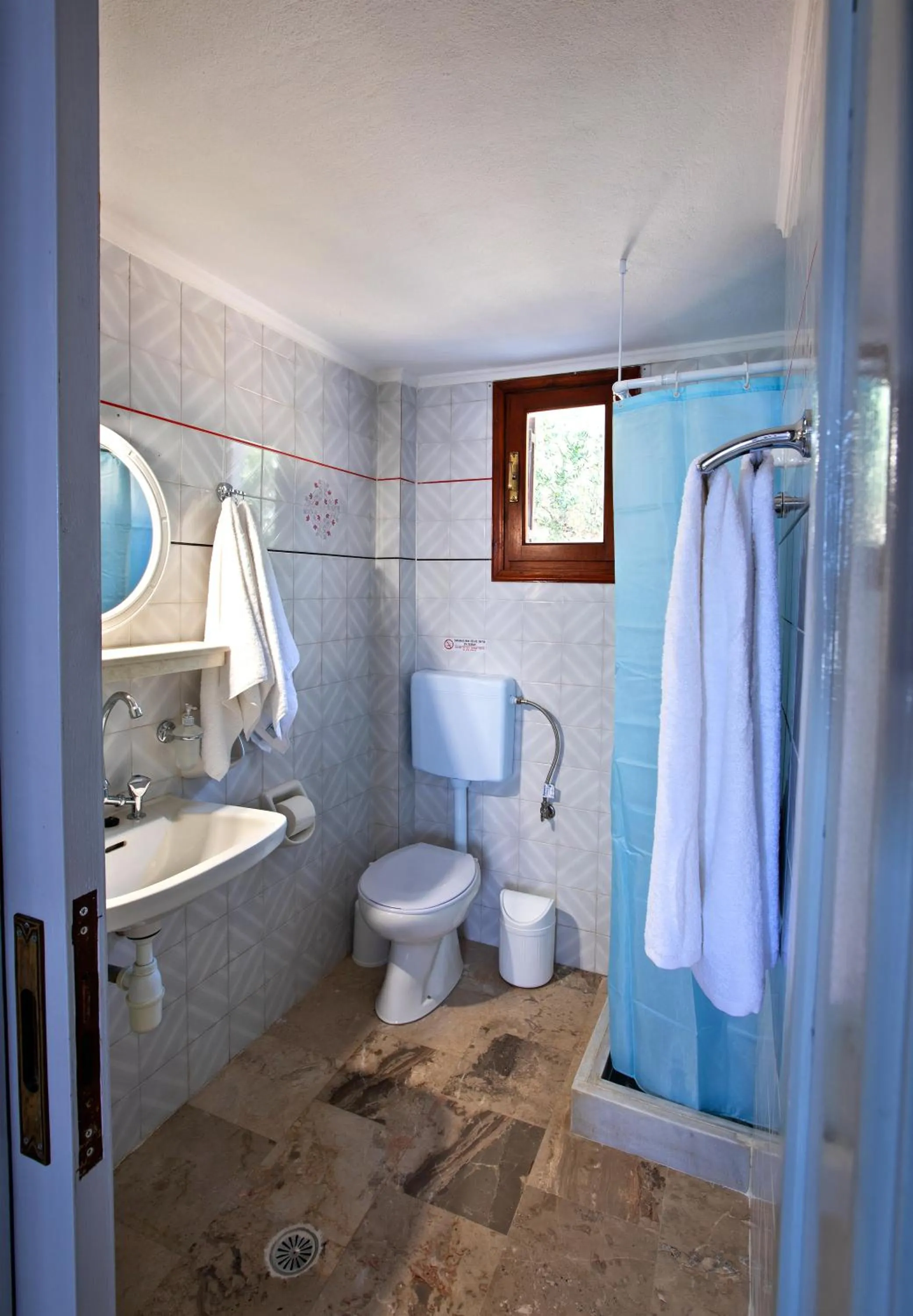 Shower in New Aurora Apts Studios