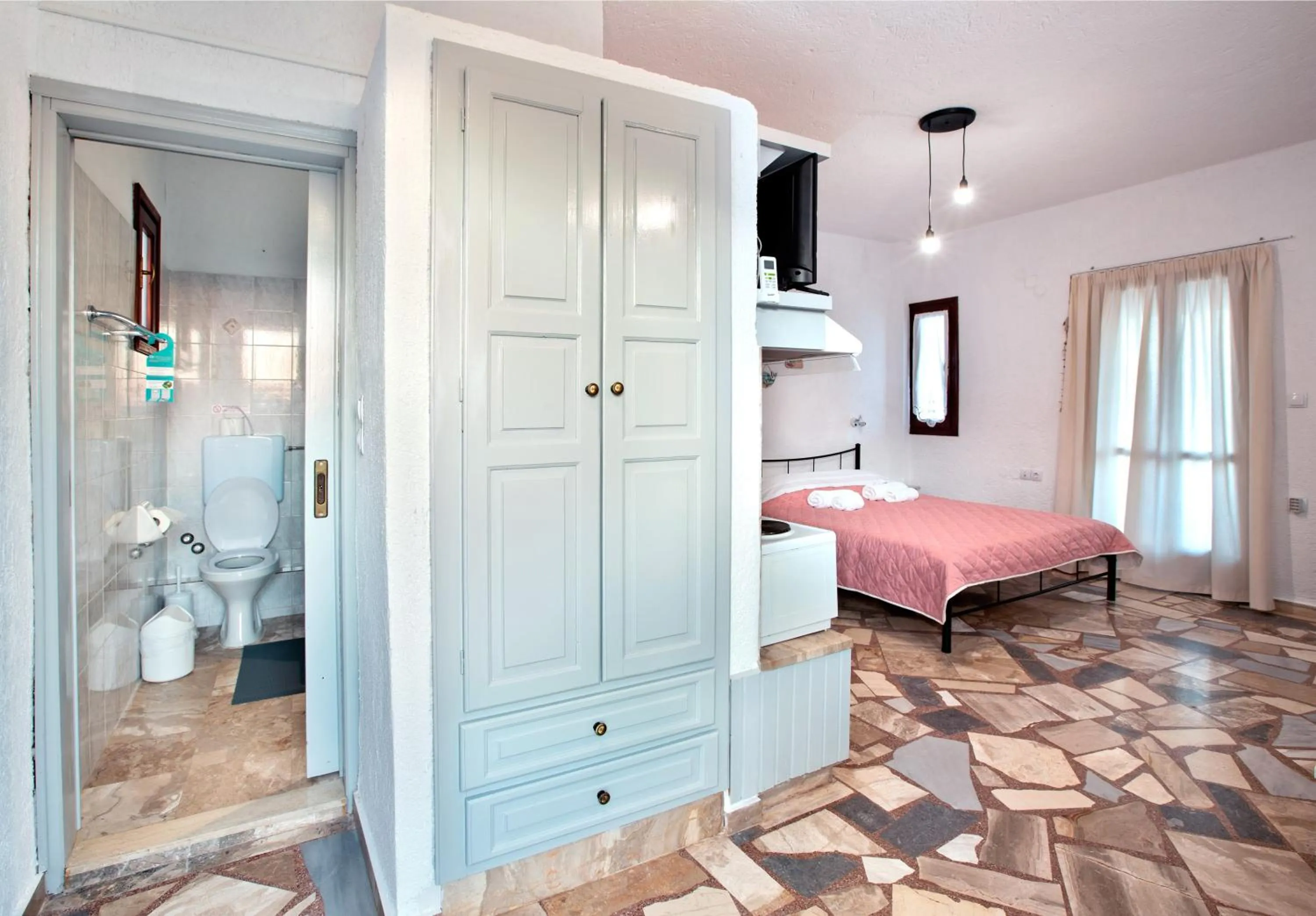 Bathroom, Bed in New Aurora Apts Studios