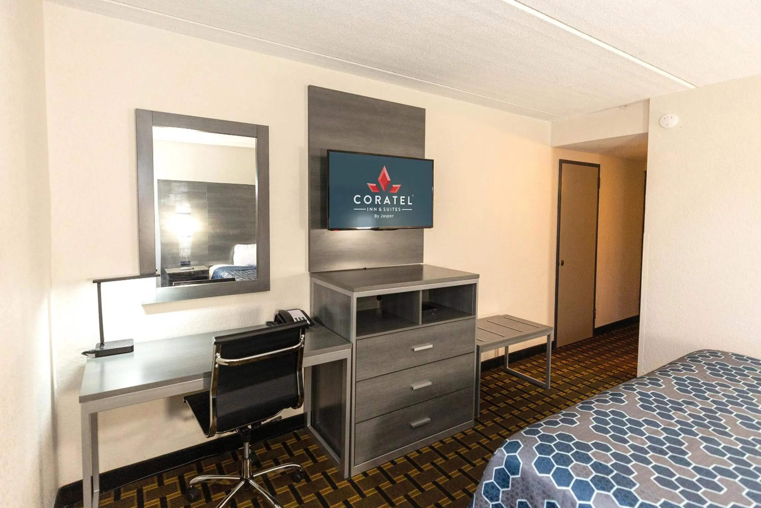 Bed in Coratel Inn & Suites by Jasper Mankato