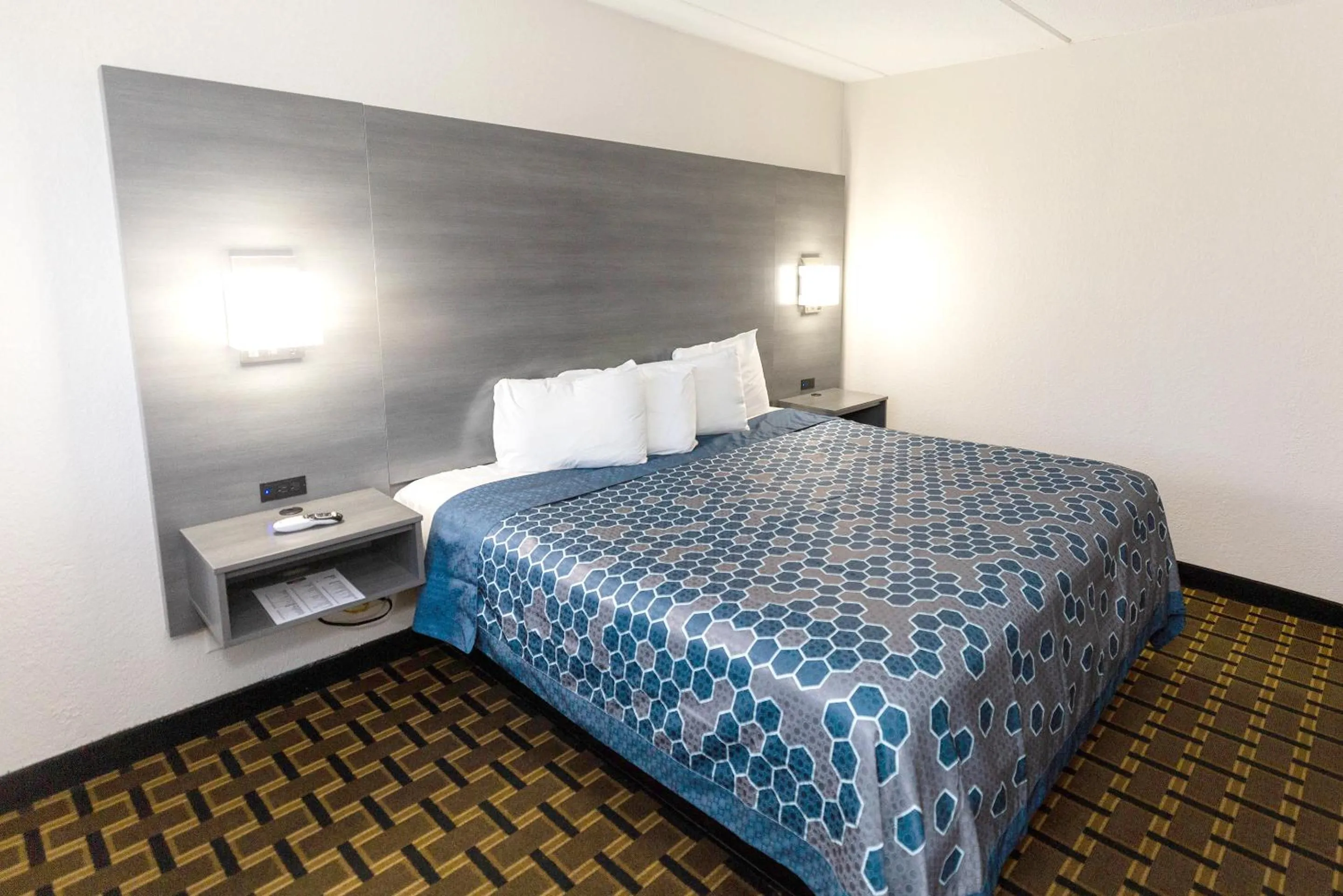 Bed in Coratel Inn & Suites by Jasper Mankato