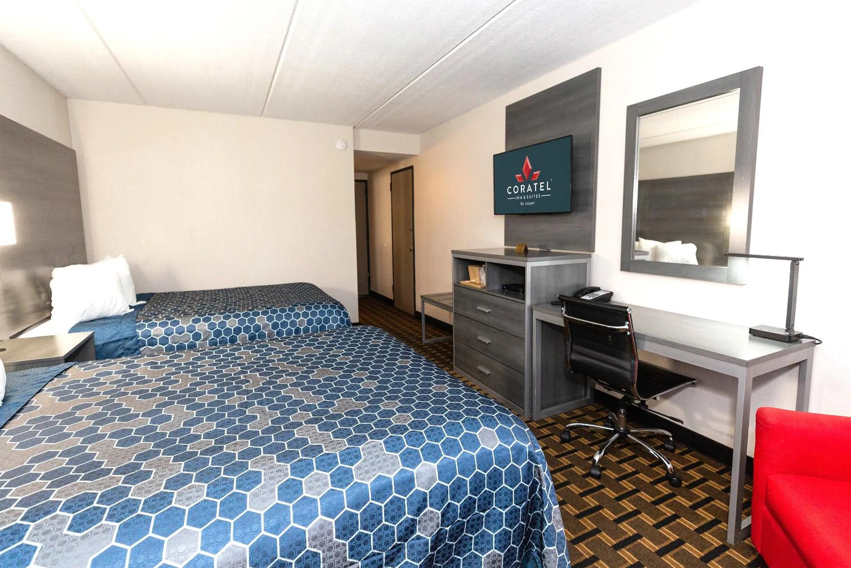 Bed in Coratel Inn & Suites by Jasper Mankato