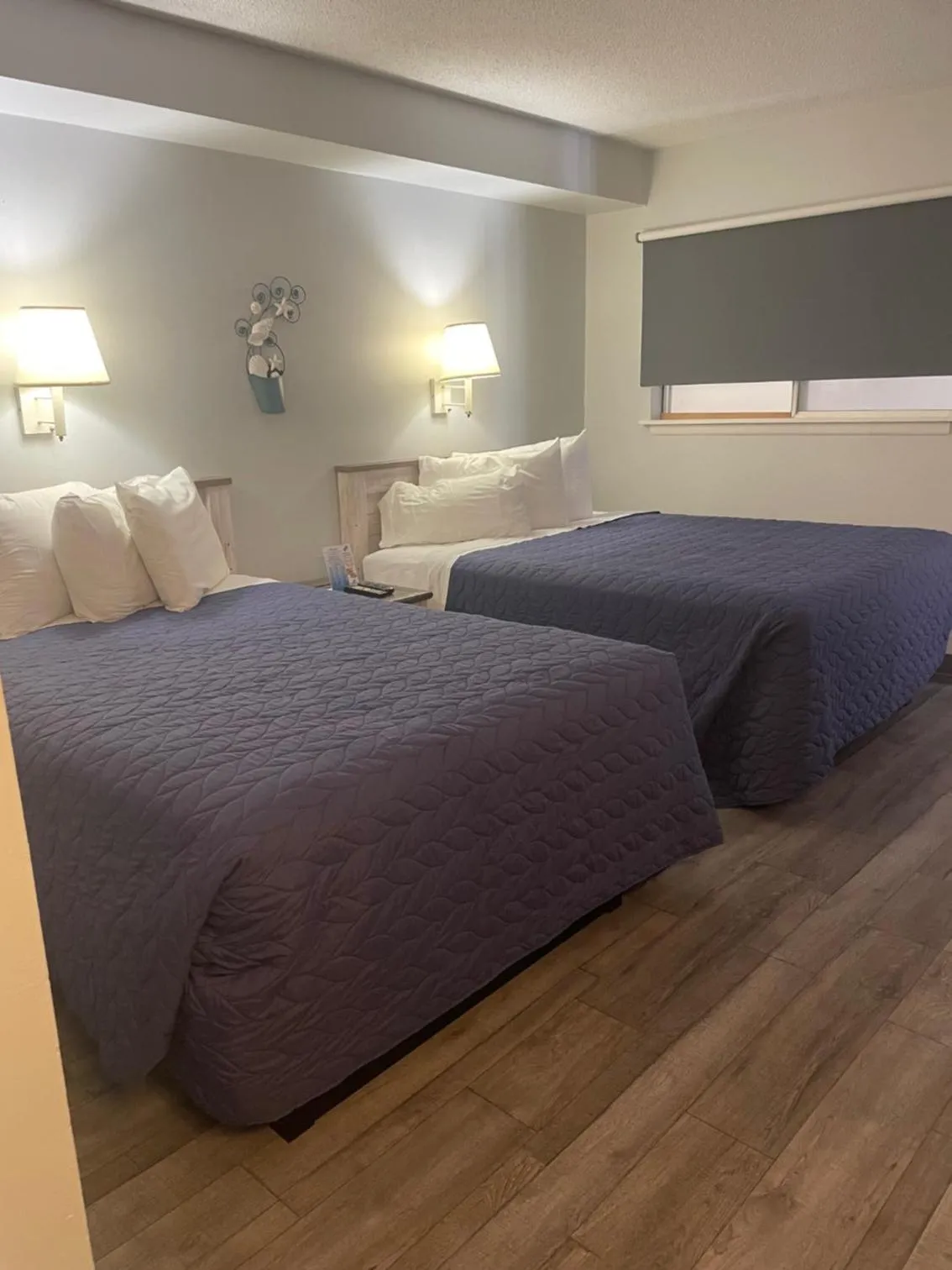 Bed in Acacia Beachfront Resort