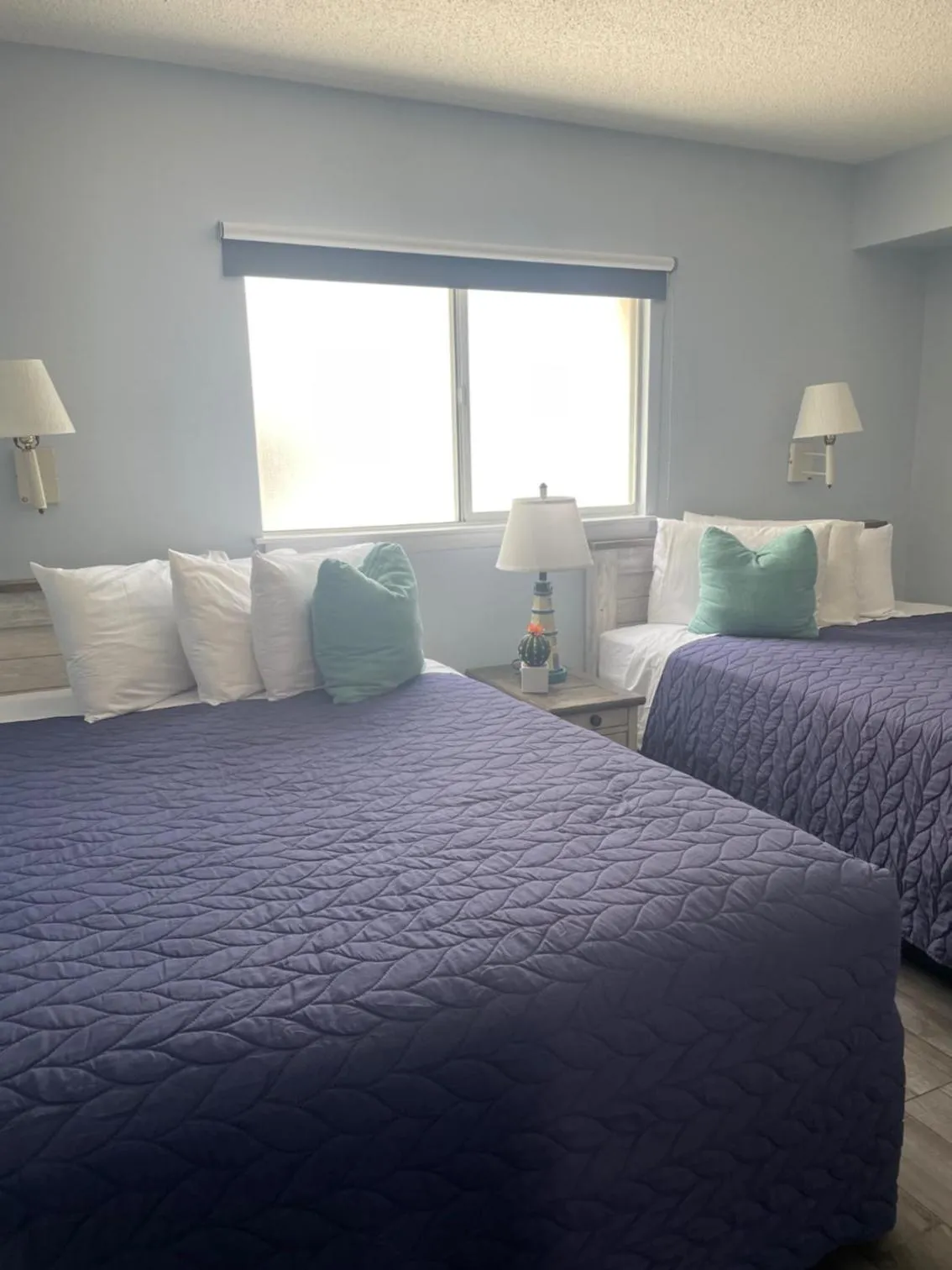 Bed in Acacia Beachfront Resort