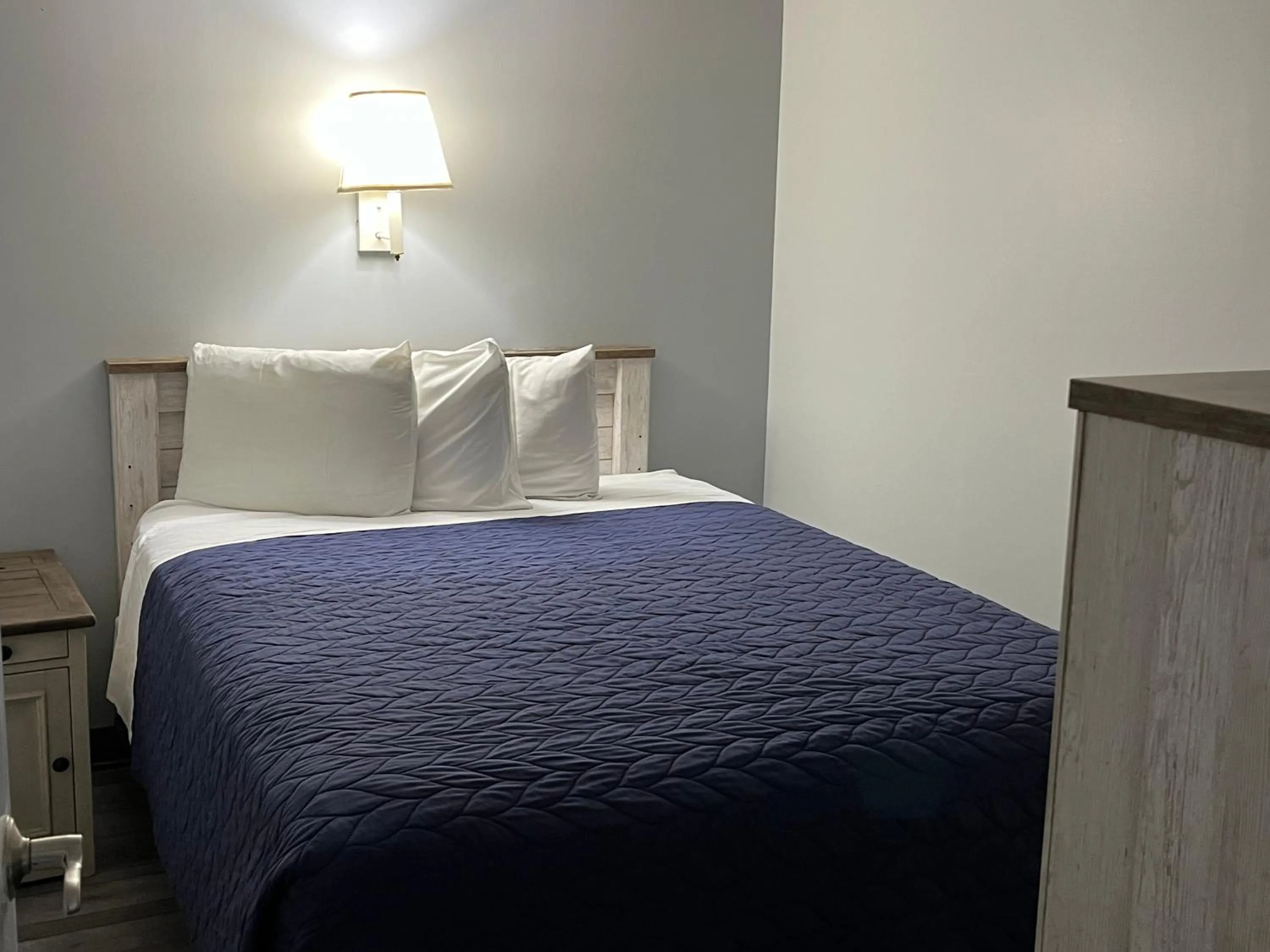 Bed in Acacia Beachfront Resort