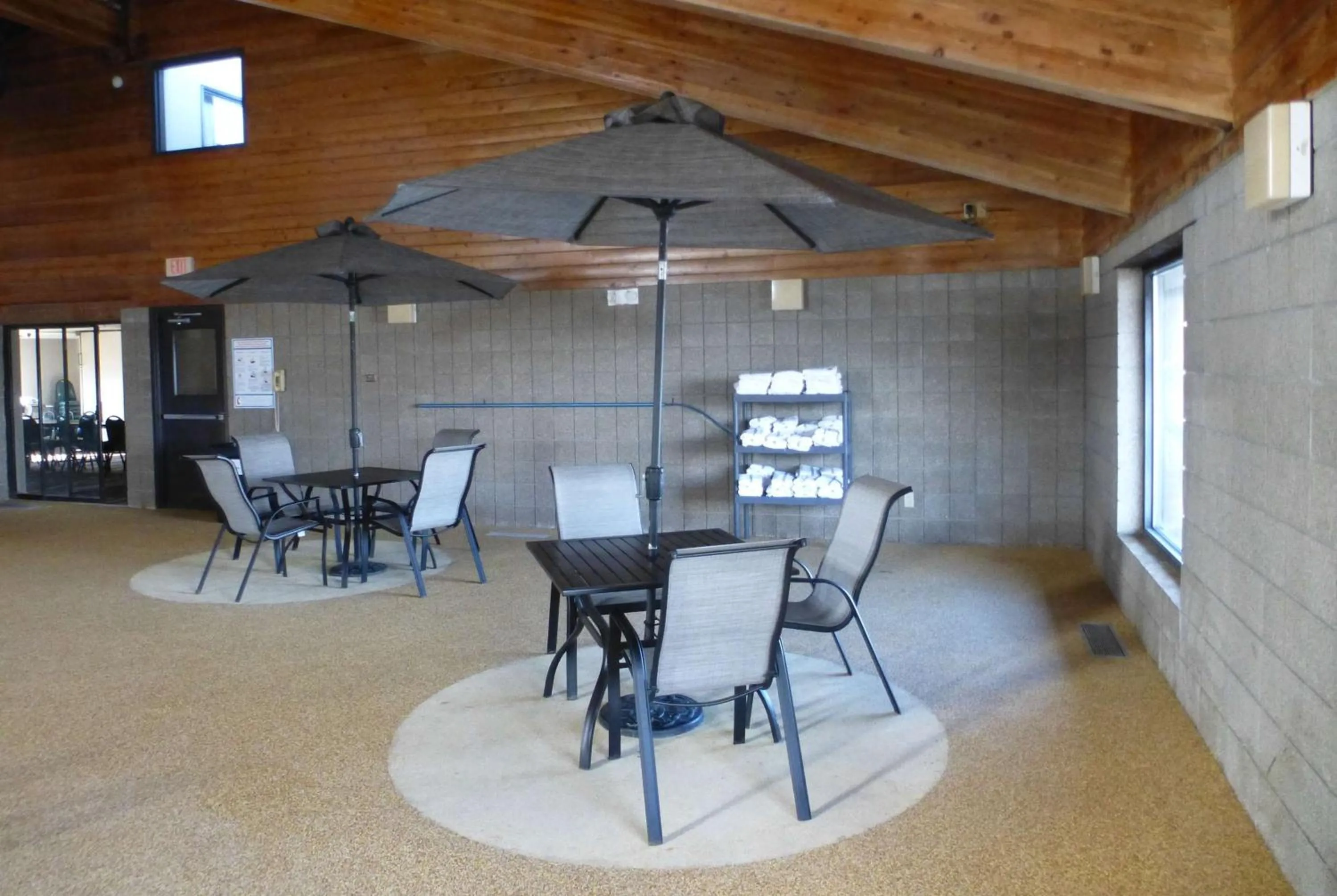 Swimming pool in AmericInn by Wyndham Mitchell