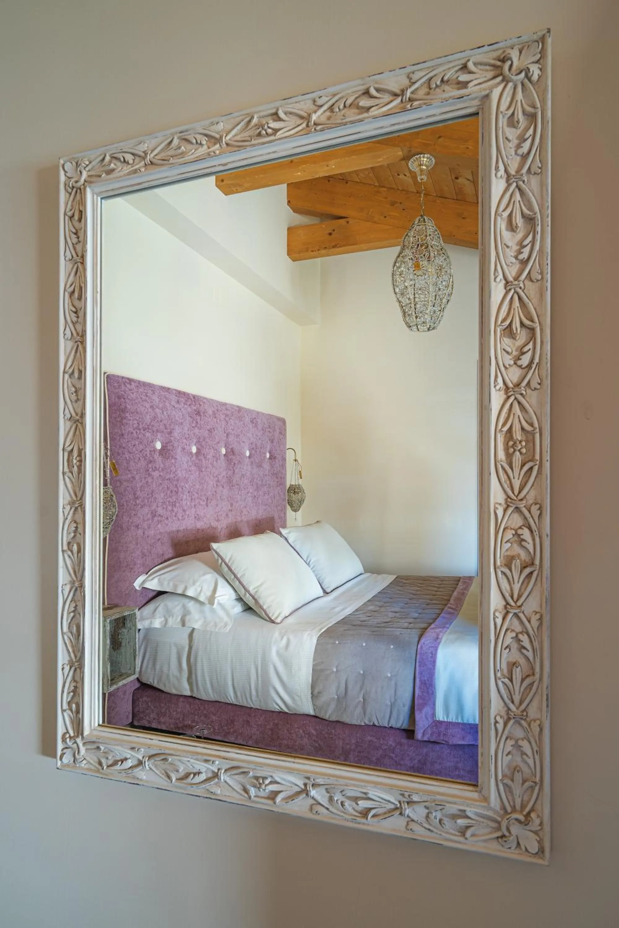 Bed in DON GIULIO LUXURY ROOMS jacuzzi