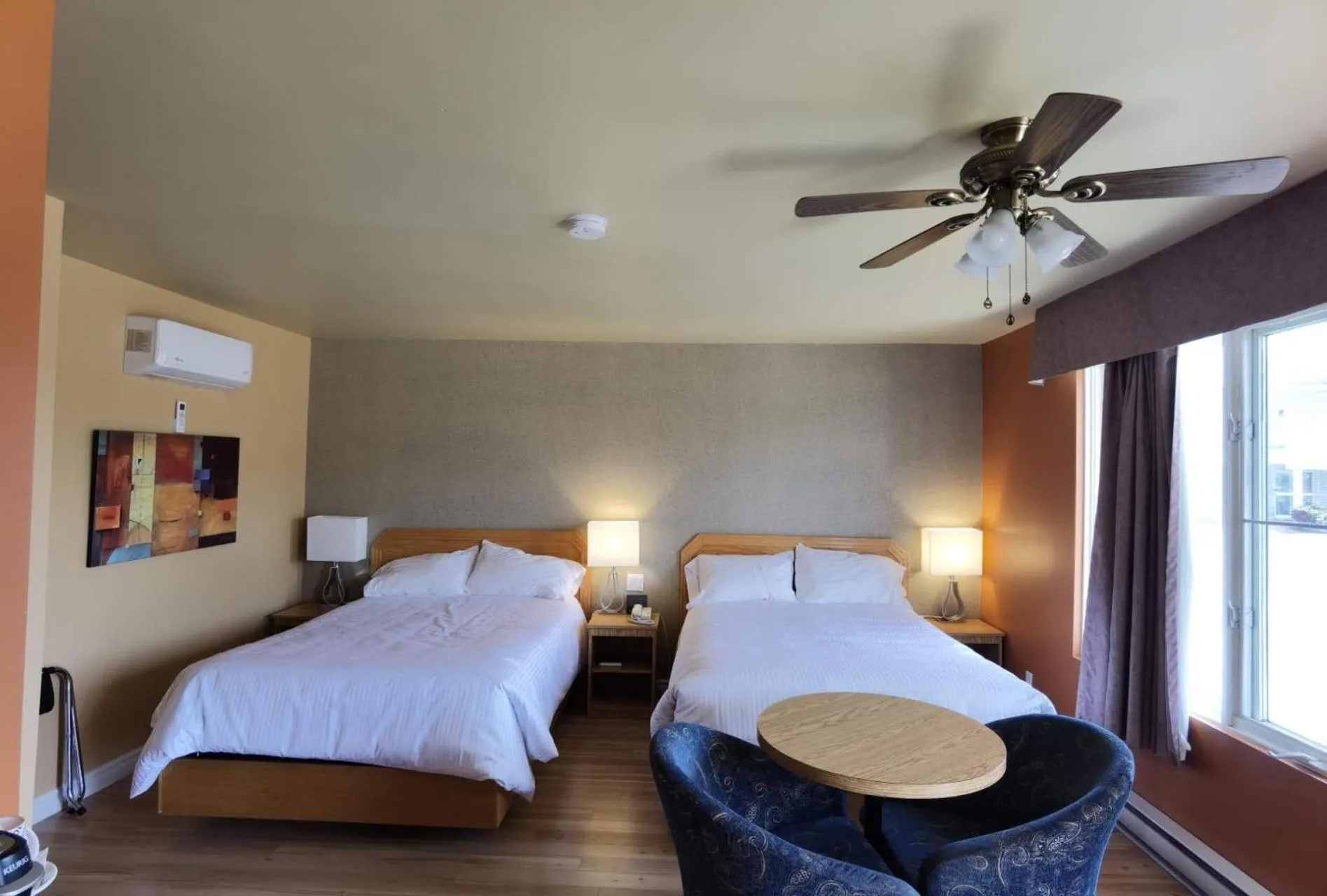 Bed in Motel Grand-Pré Inc