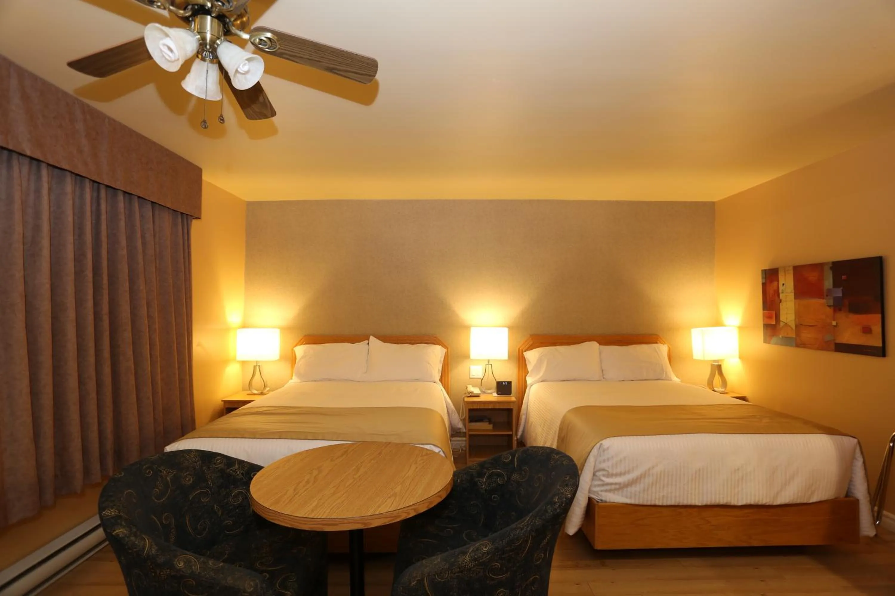 Bed in Motel Grand-Pré Inc