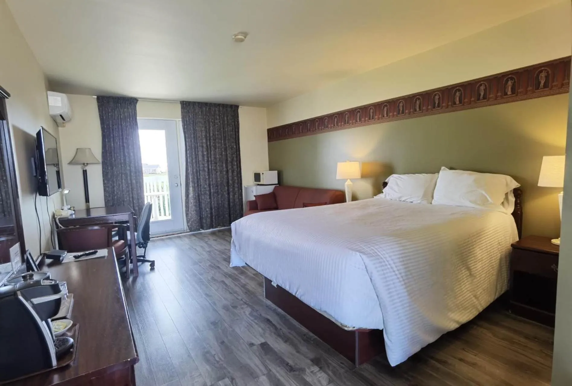 Bed in Motel Grand-Pré Inc