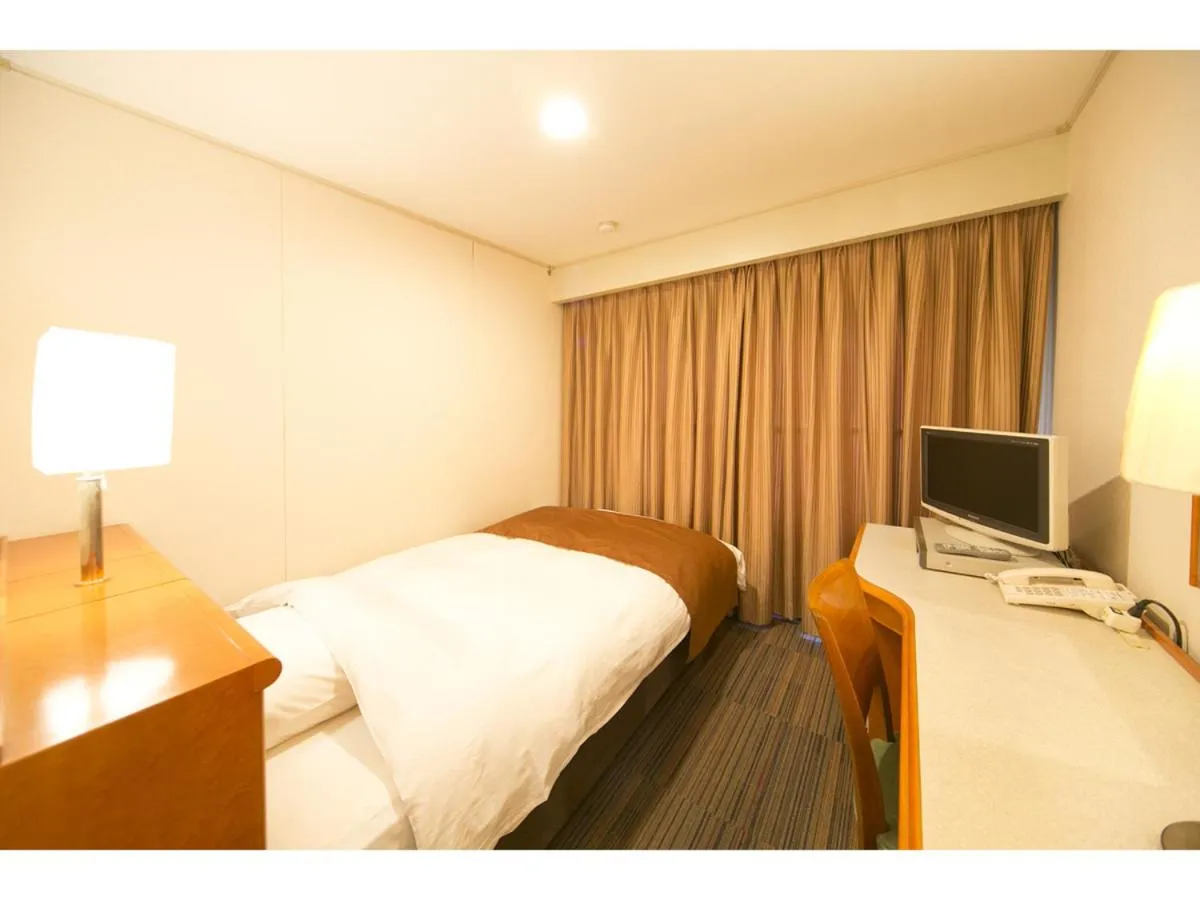 Bed in Hyper-inn Takamatsu Ekimae