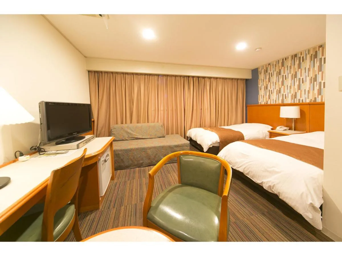 Bed in Hyper-inn Takamatsu Ekimae