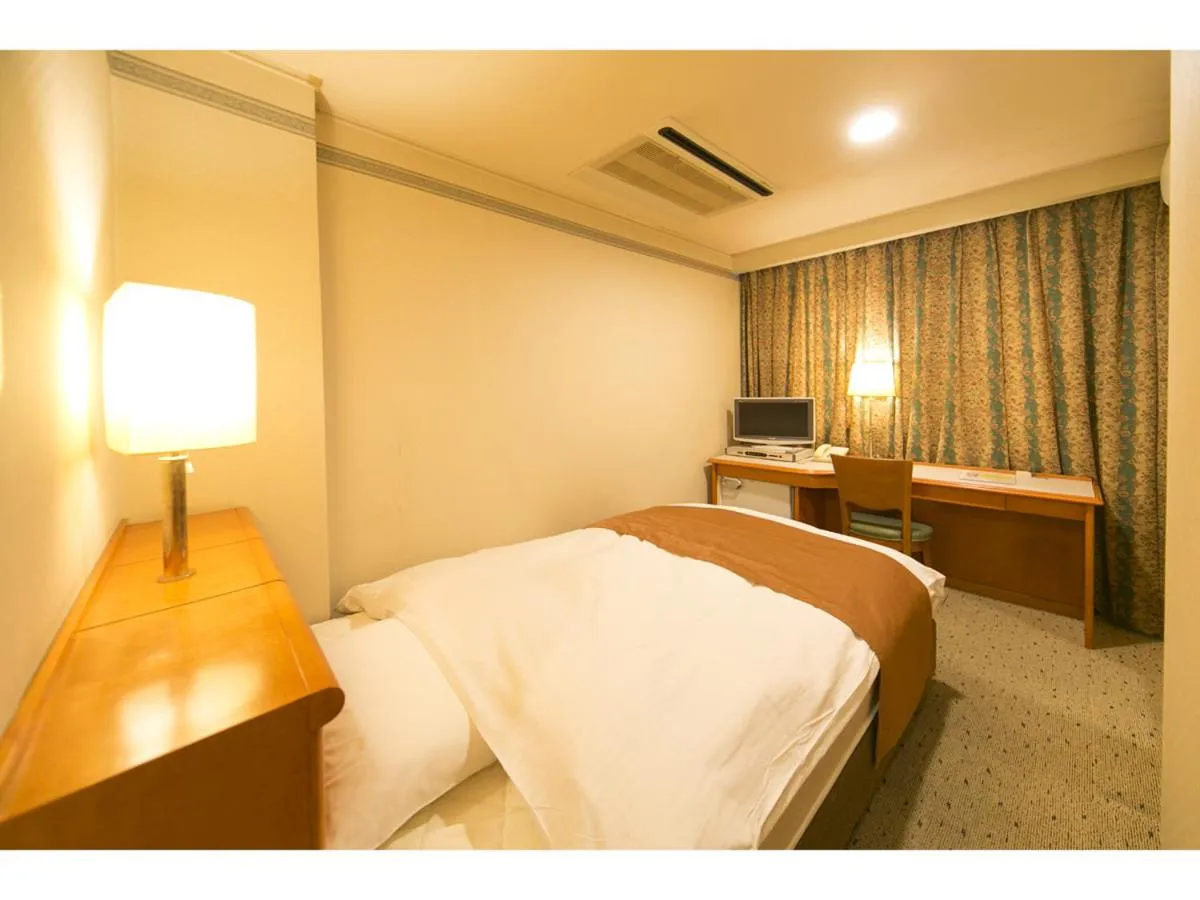 Bed in Hyper-inn Takamatsu Ekimae