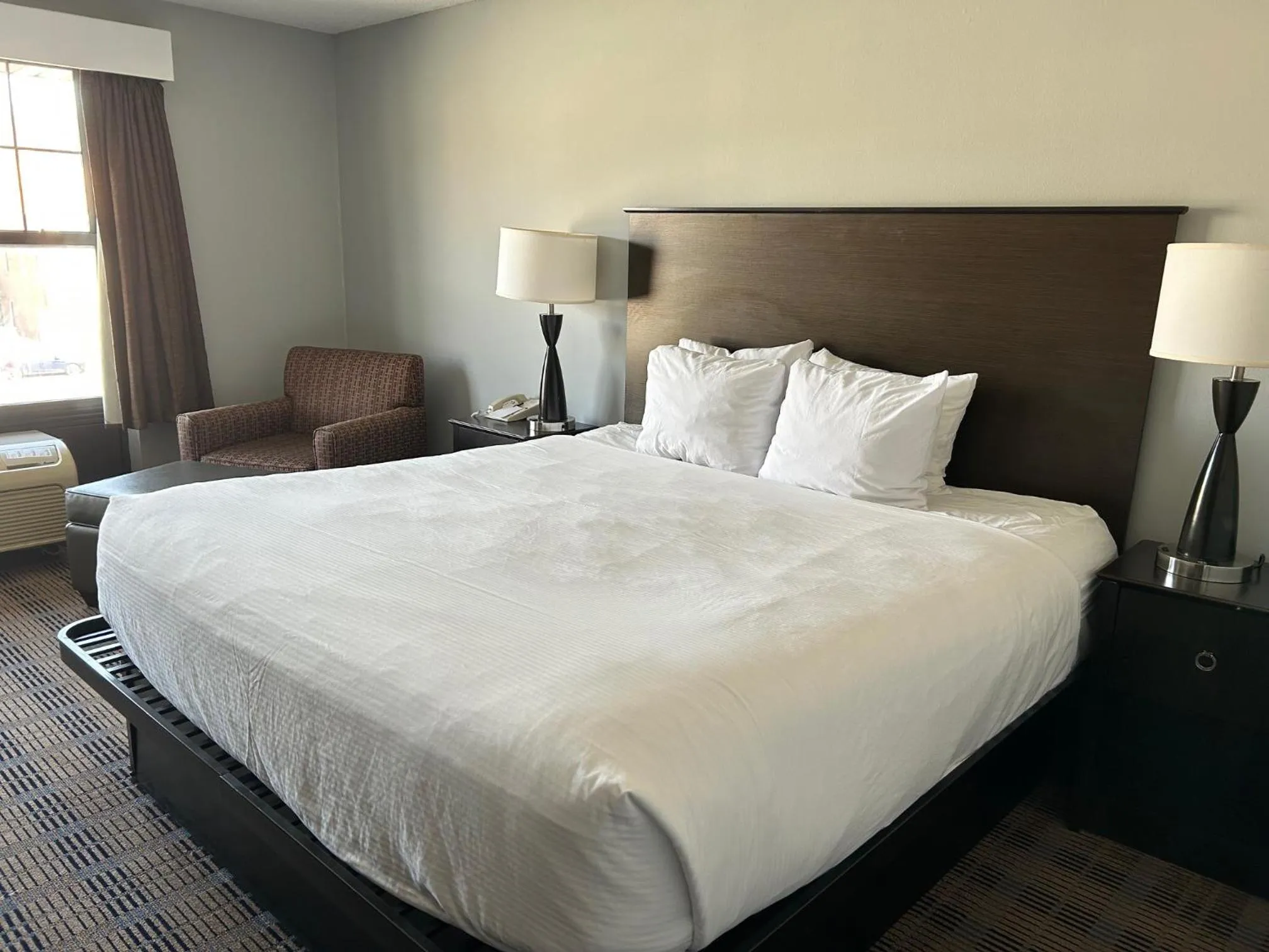 Bed in AmericInn by Wyndham Ottumwa