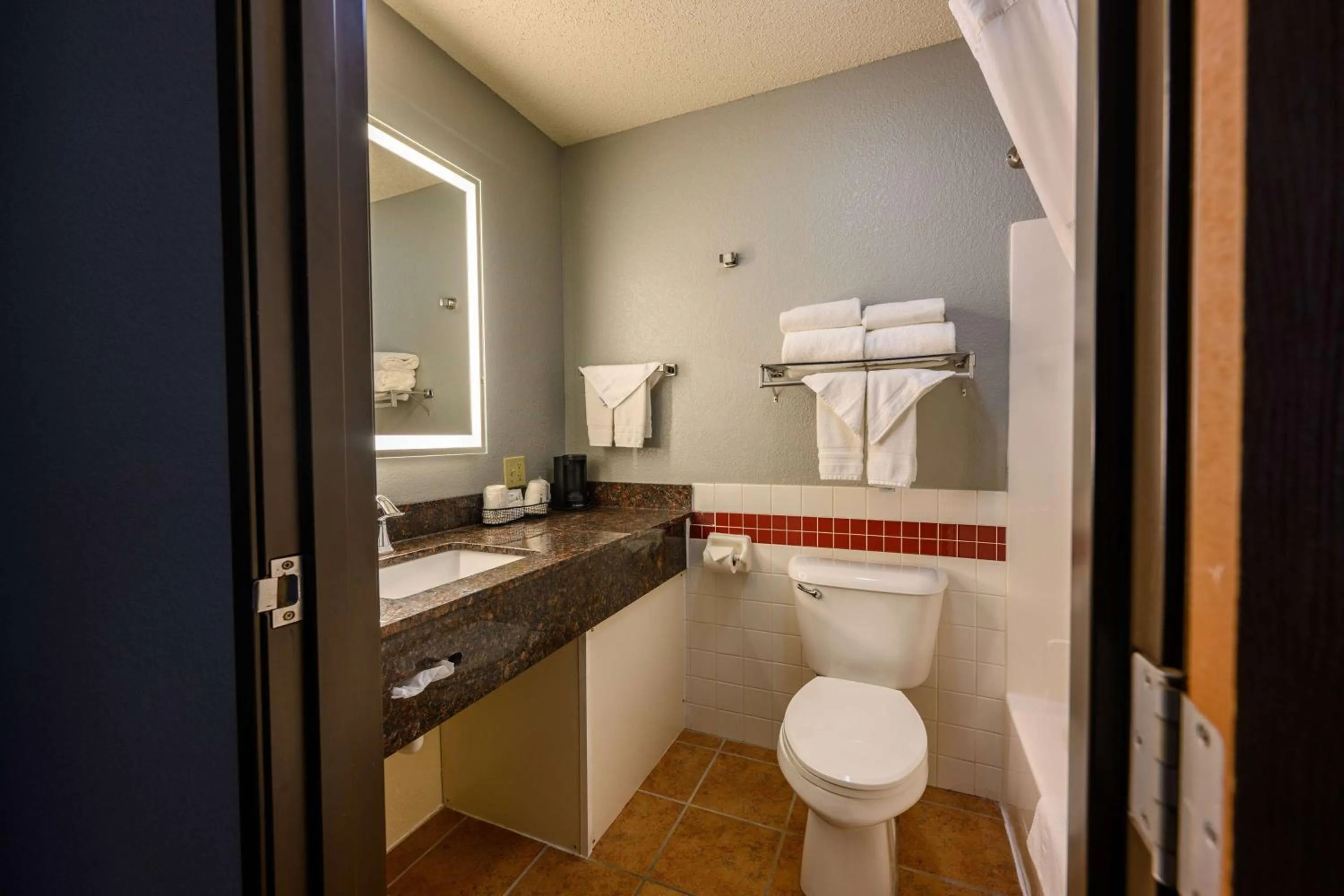 Bathroom in AmericInn by Wyndham Monroe