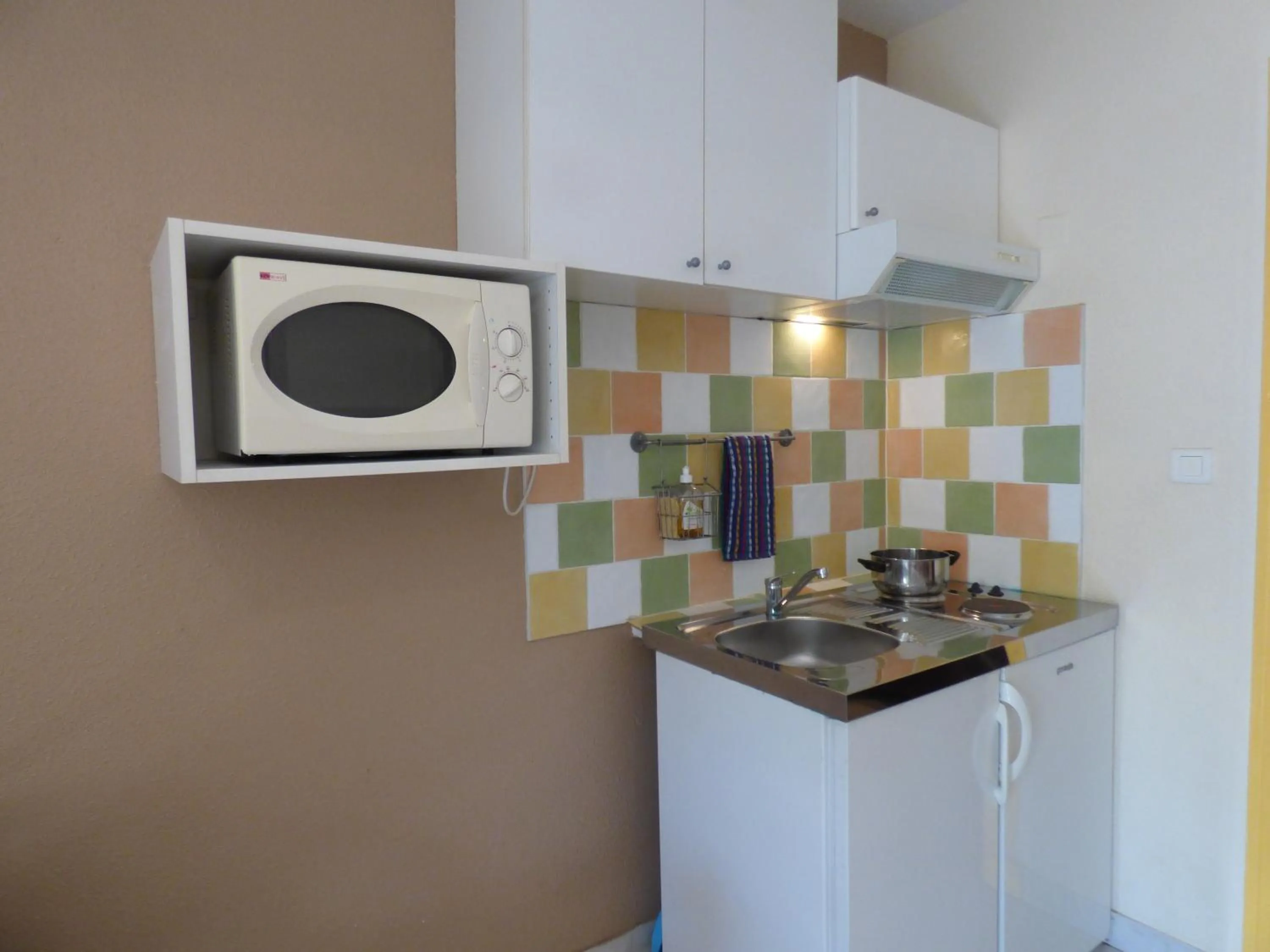 Kitchen or kitchenette in Appart'Hotel Festival Sud Suites - Avignon TGV
