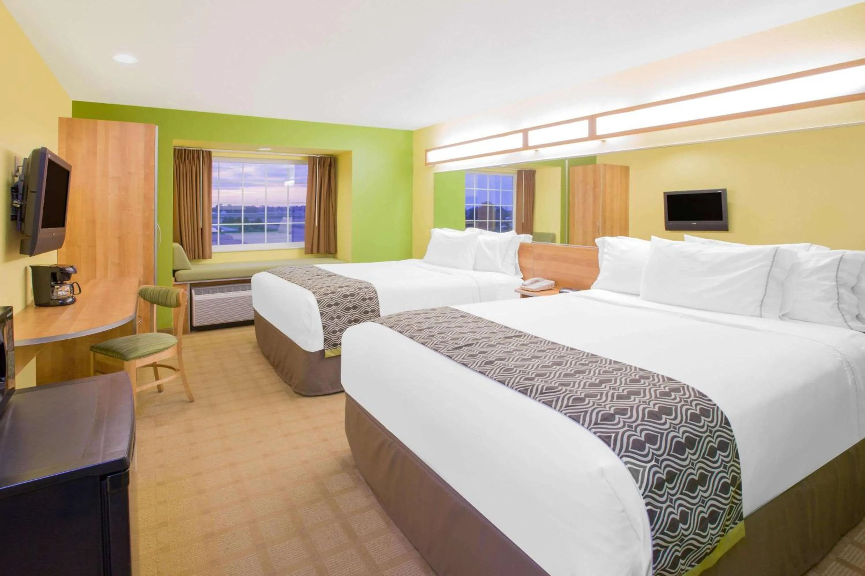 Photo of the whole room, Bed in Microtel Inn & Suites by Wyndham Delphos