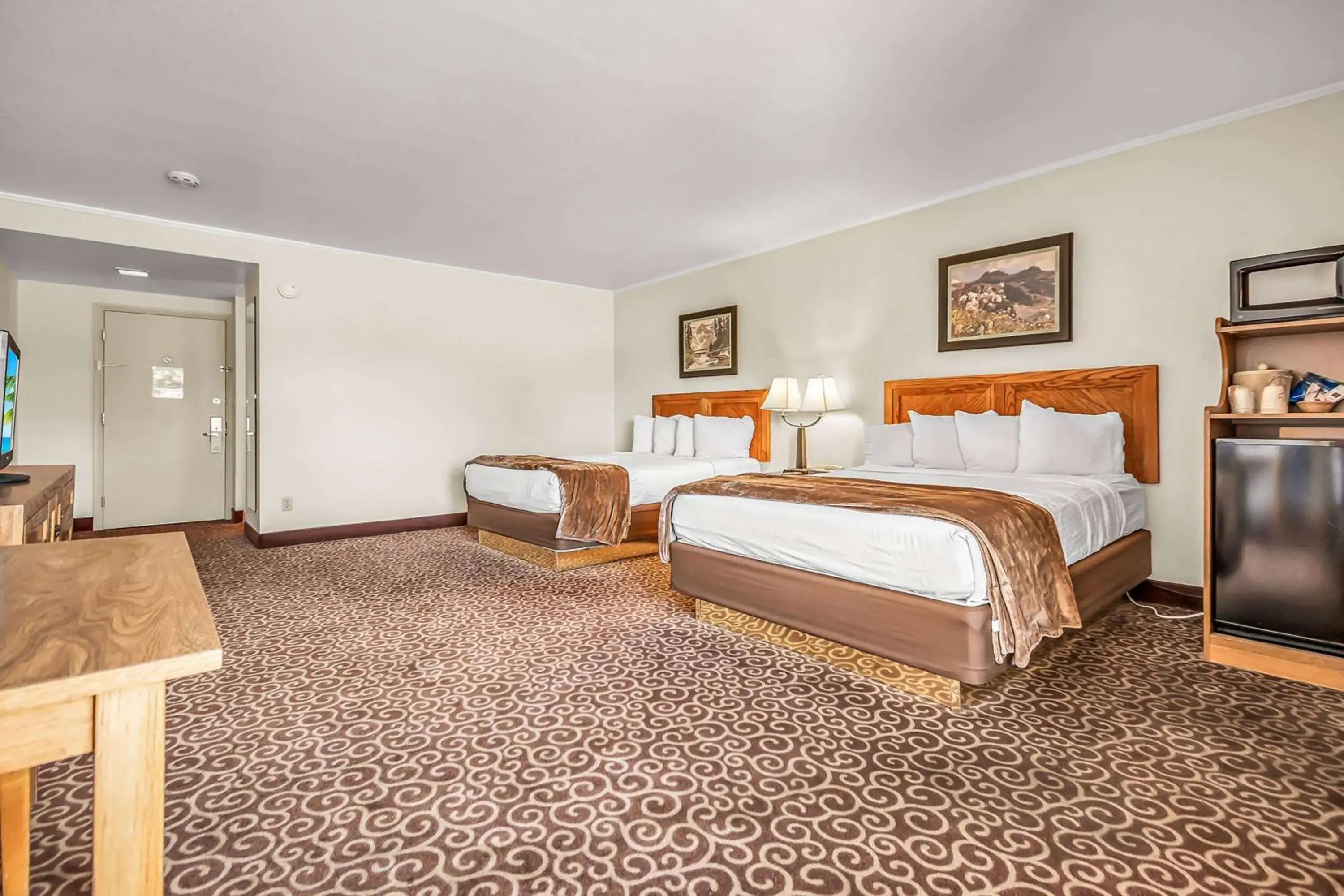 Queen Room with Two Queen Beds, Mobility Access and Roll-In shower, Non-Smoking in Red Arrow Inn & Suites, a Travelodge by Wyndham Queen Room with Two Queen Beds, Mobility Access and Roll-In shower, Non-Smoking in Red Arrow Inn & Suites, a Travelodge by Wyndham