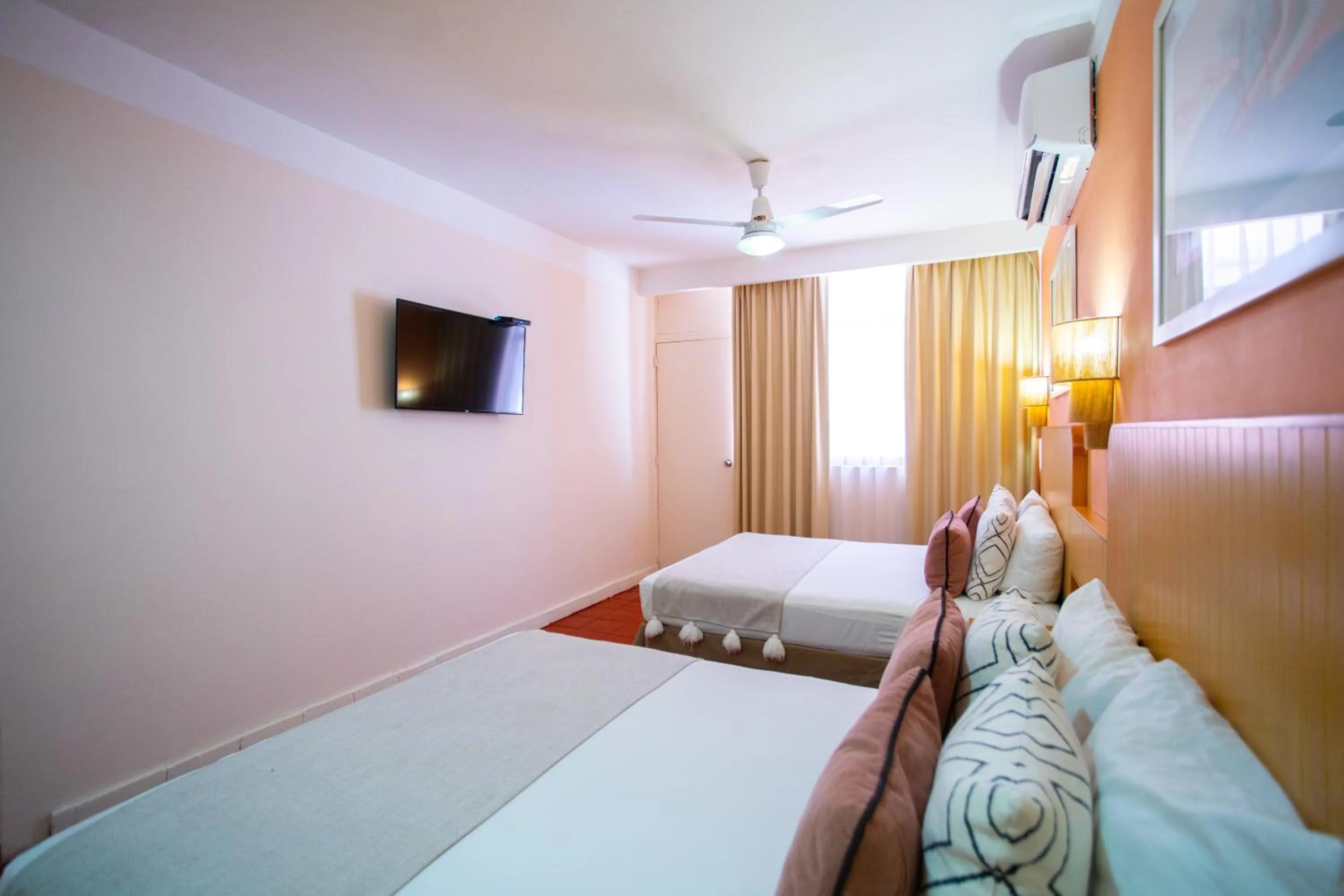 Bed in Hotel Tropicus Boutique