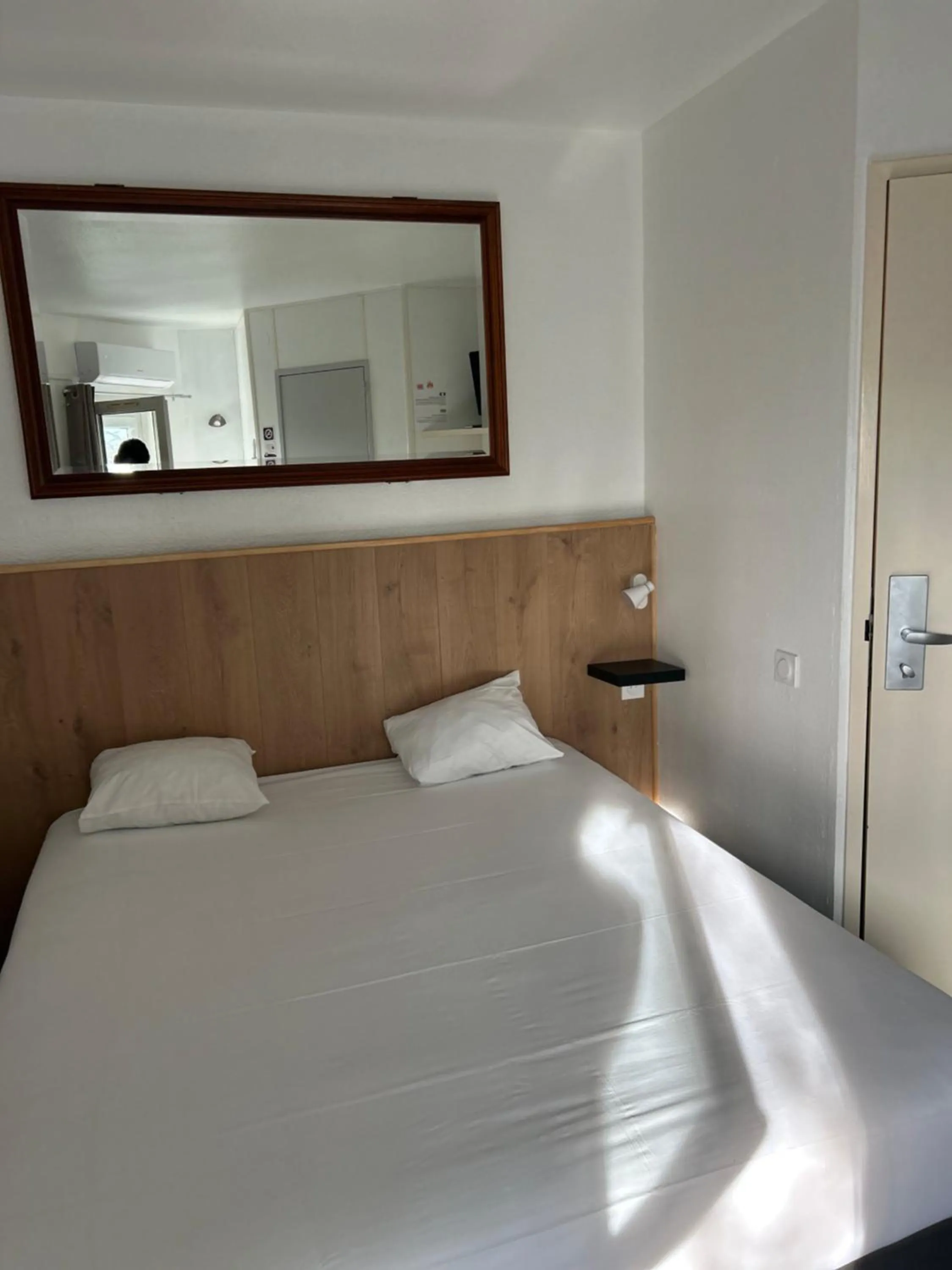 Bed in Kyriad Direct Macon Sud