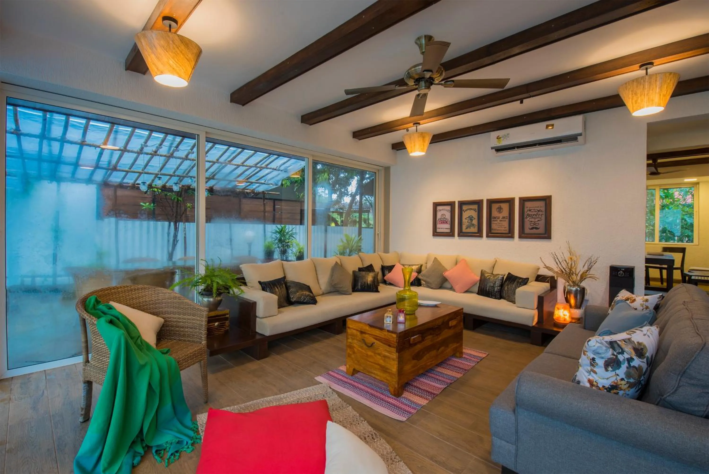 Living room in EL Lodge by StayVista - Pool, lawn, and a charming gazebo for your perfect getaway