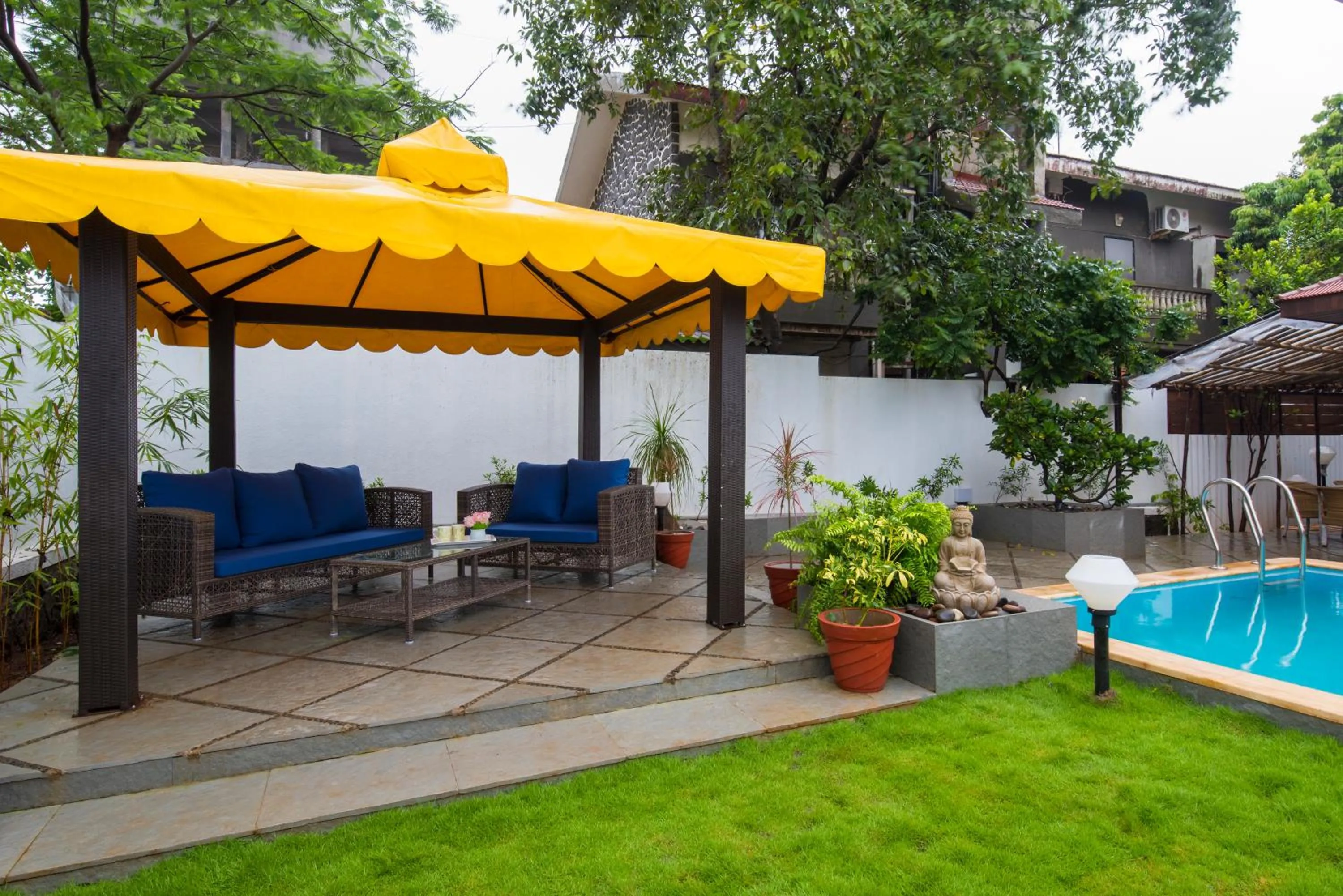 Garden in EL Lodge by StayVista - Pool, lawn, and a charming gazebo for your perfect getaway