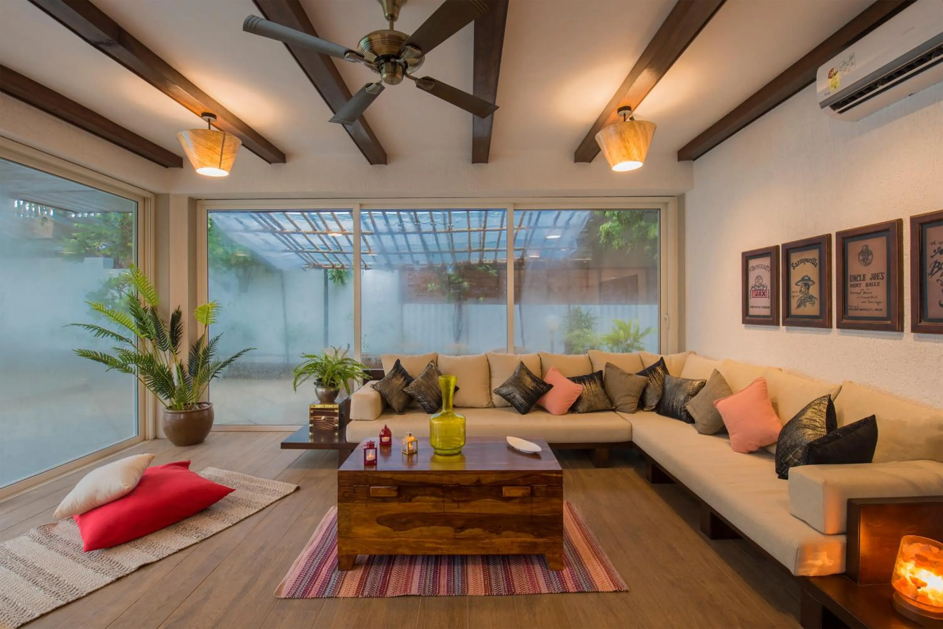 Living room in EL Lodge by StayVista - Pool, lawn, and a charming gazebo for your perfect getaway
