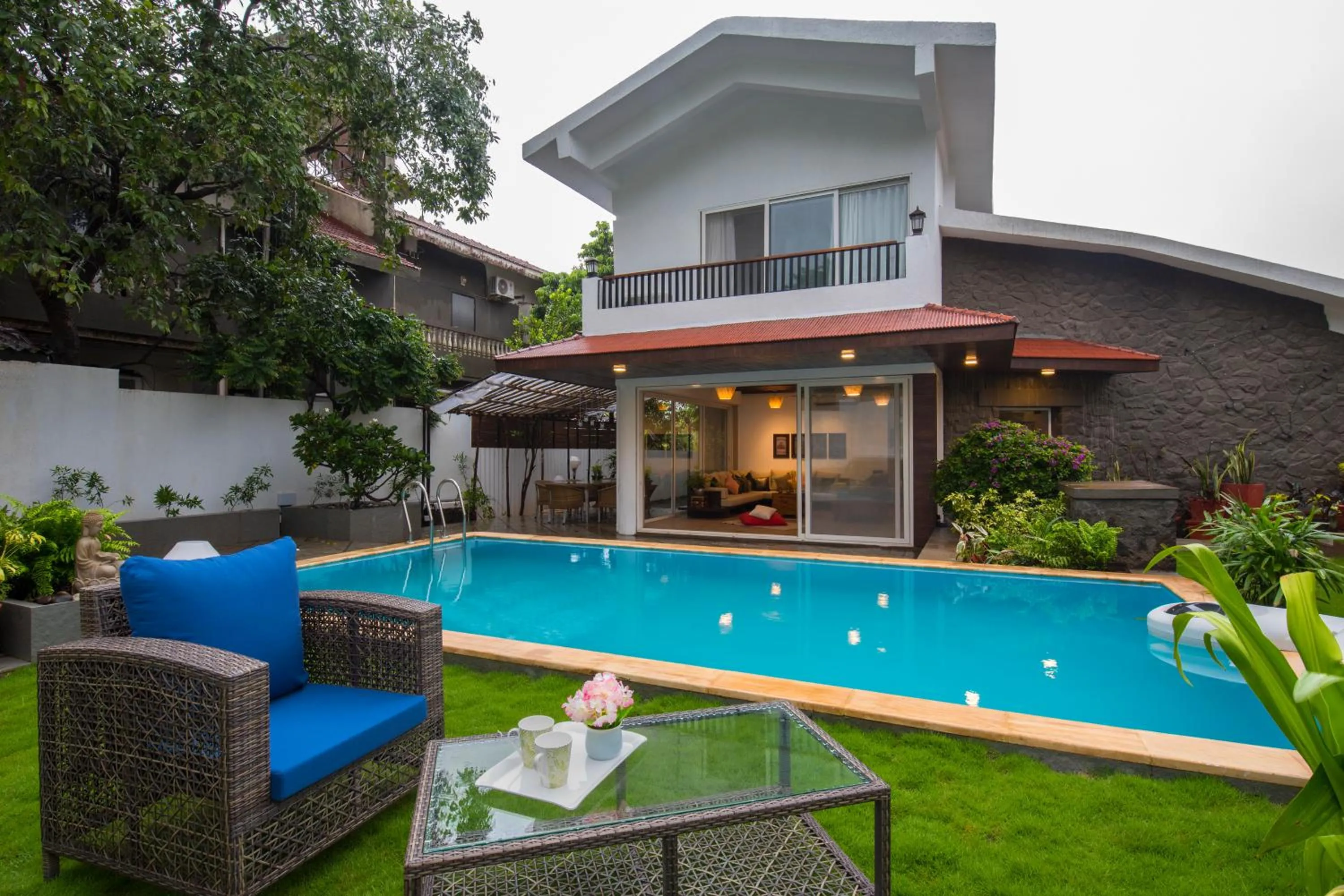 Property building in EL Lodge by StayVista - Pool, lawn, and a charming gazebo for your perfect getaway