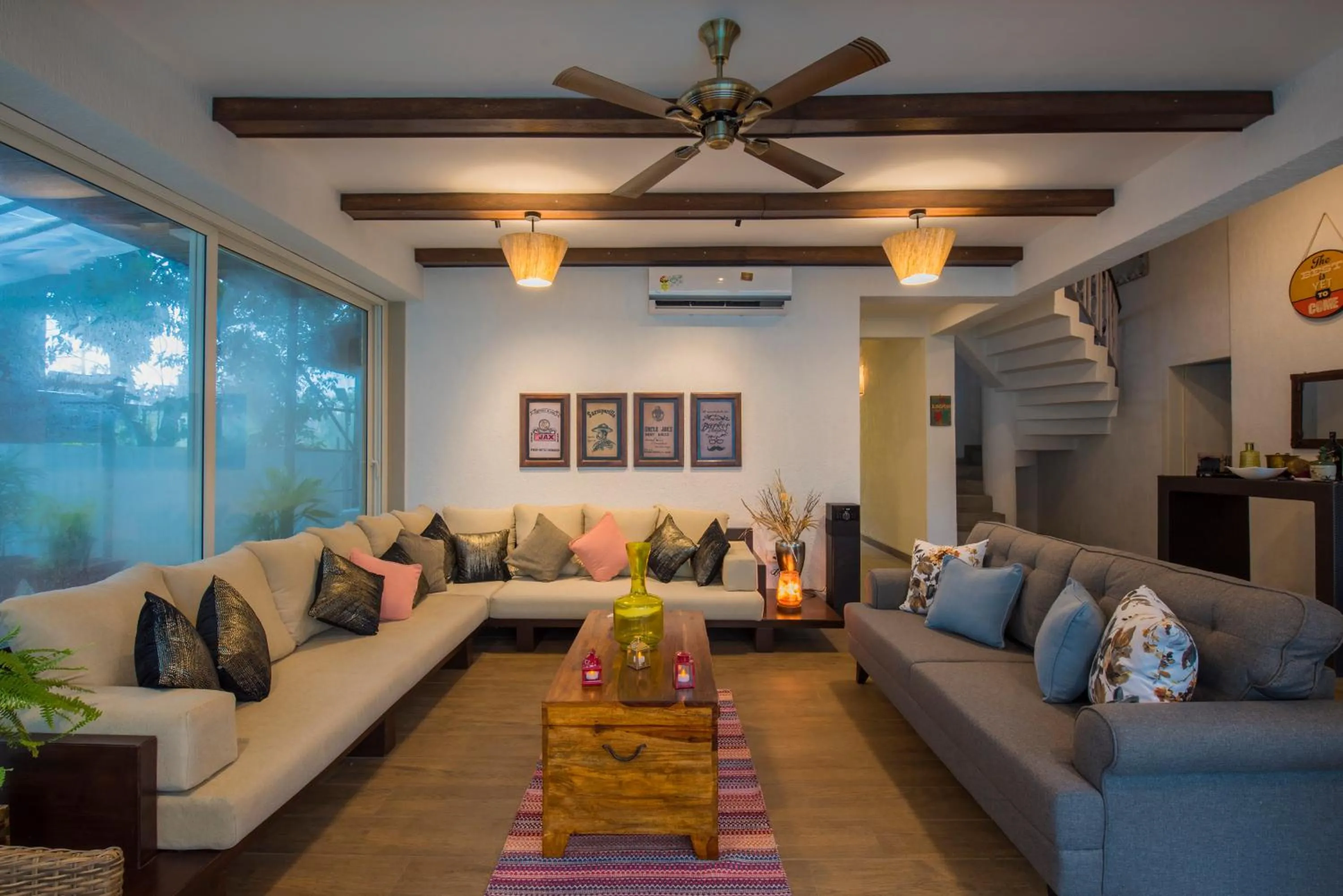 Living room in EL Lodge by StayVista - Pool, lawn, and a charming gazebo for your perfect getaway