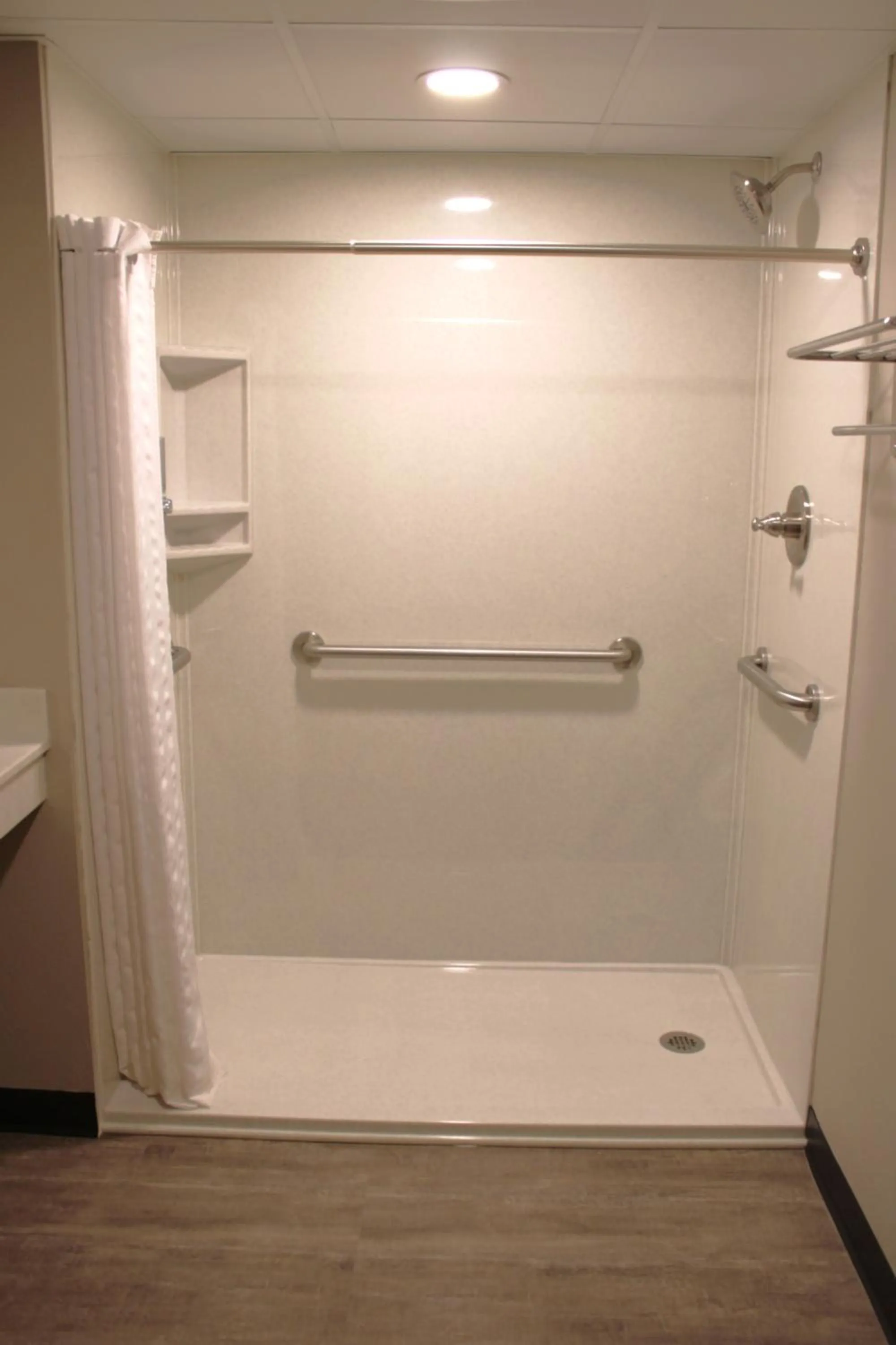 Shower in Boarders Inn and Suites by Cobblestone Lamar Missouri