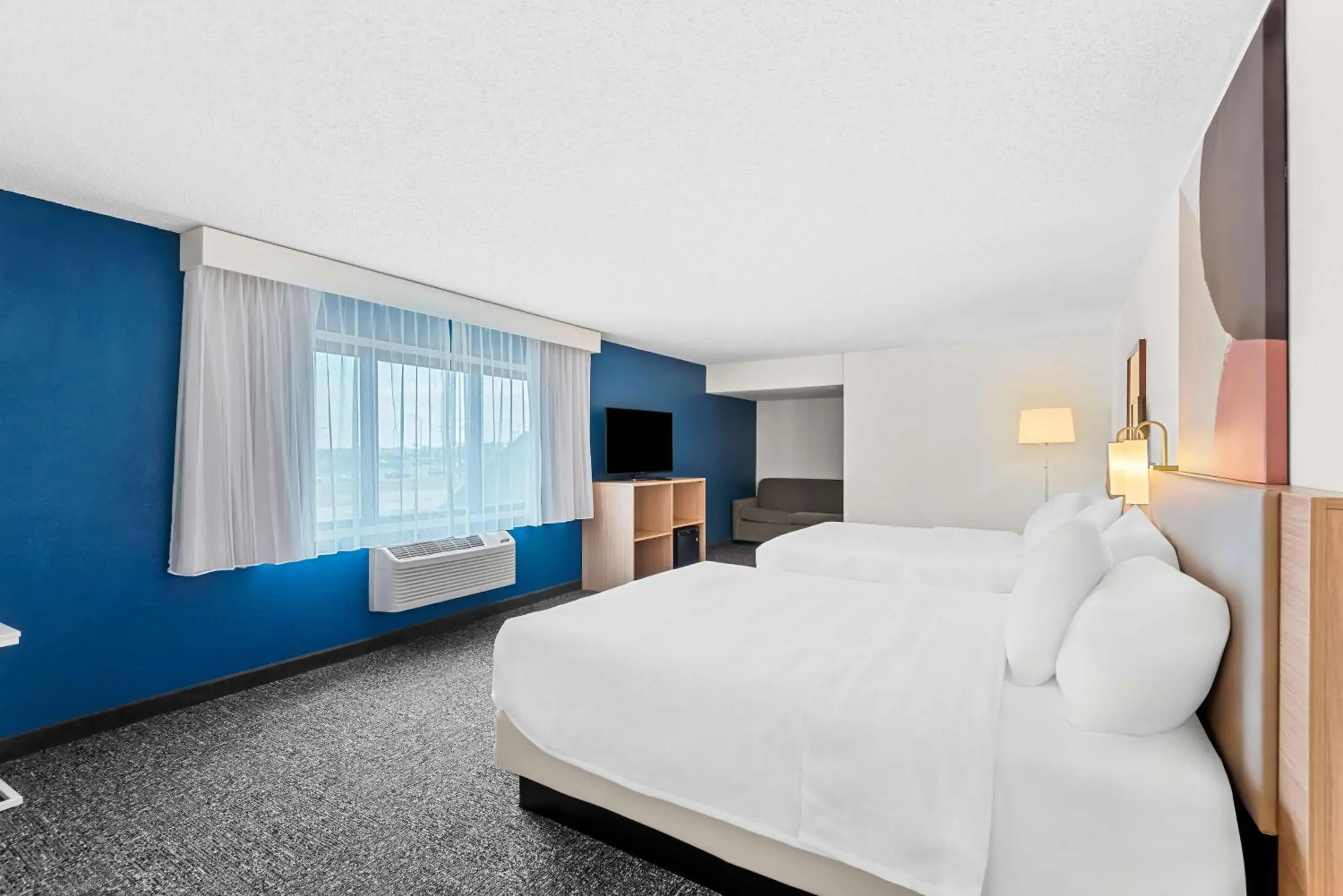 Queen Room with Two Queen Beds and Sofa Bed in Spark by Hilton Cedar Falls Queen Room with Two Queen Beds and Sofa Bed in Spark by Hilton Cedar Falls