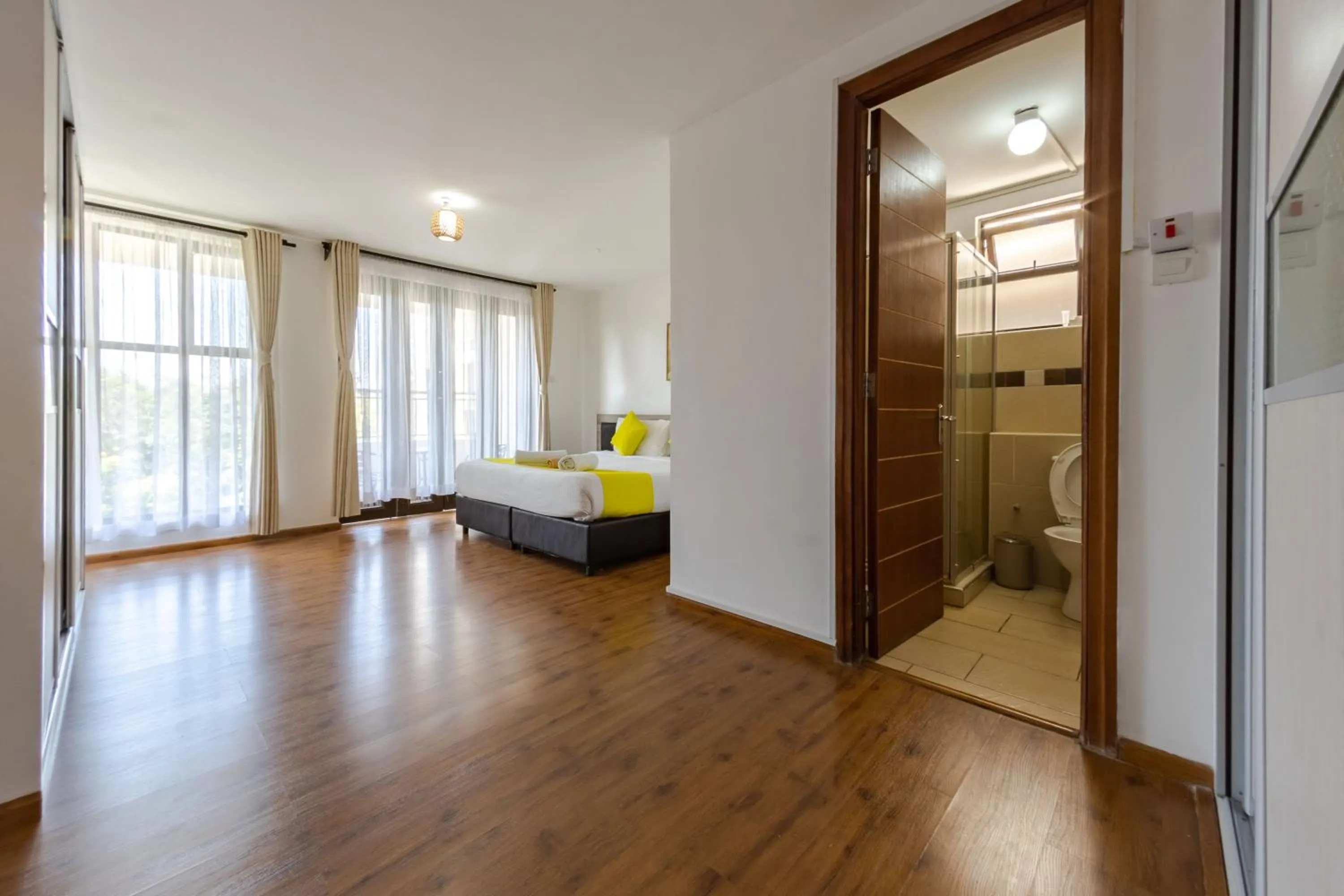 Toilet, Bed in Erica Residences - Riverside